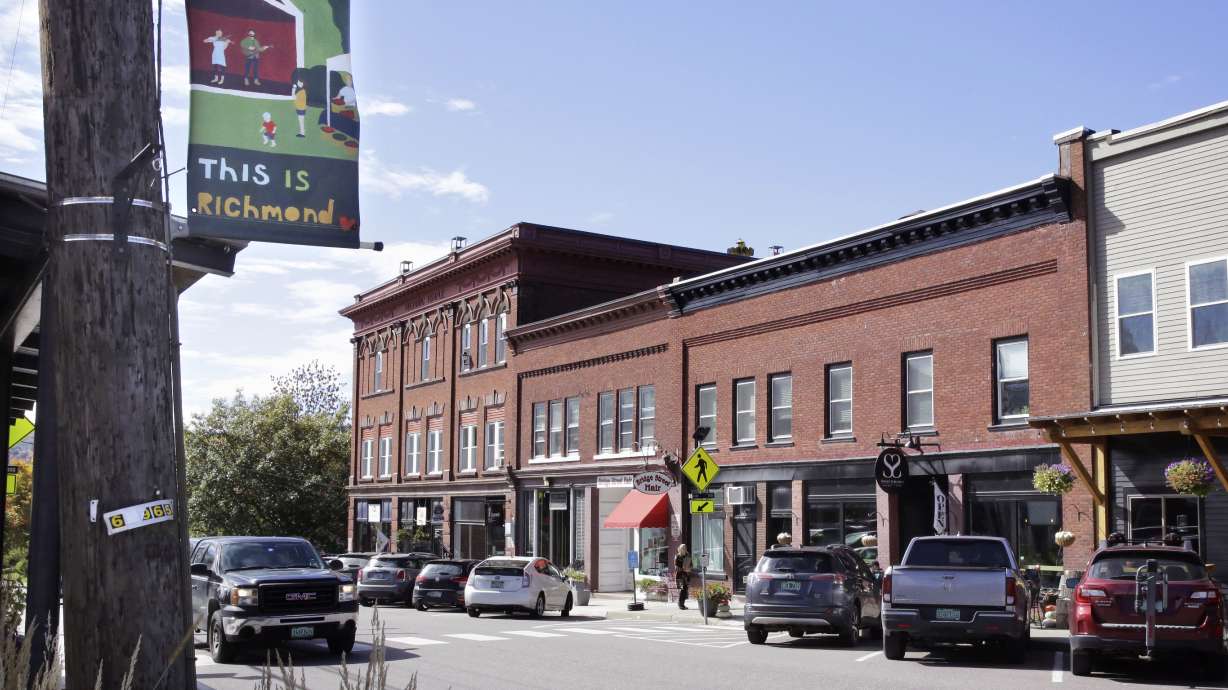 A pick-up truck rolls through downtown, Wednesday, in Richmond, Vt. A town employee in Richmond is under fire for lowering the fluoride level in the drinking water below the state's recommended level for more than three years. A town commission has voted to return the water to full fluoridation after outrage from some residents.