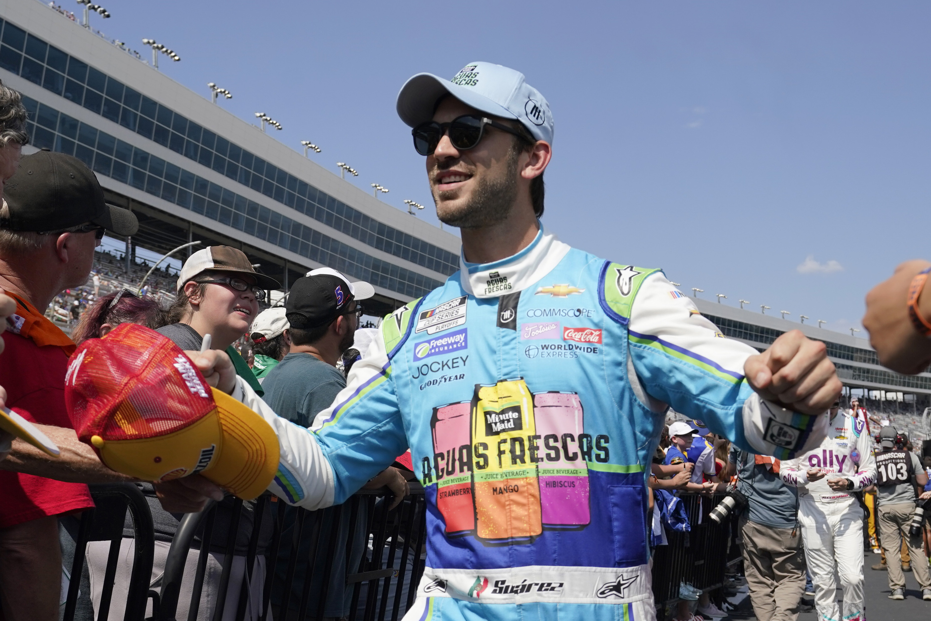 Daniel Suarez walks during driver introductions before the NASCAR Cup Series auto race at Texas Motor Speedway in Fort Worth, Texas, Sunday, Sept. 25, 2022.