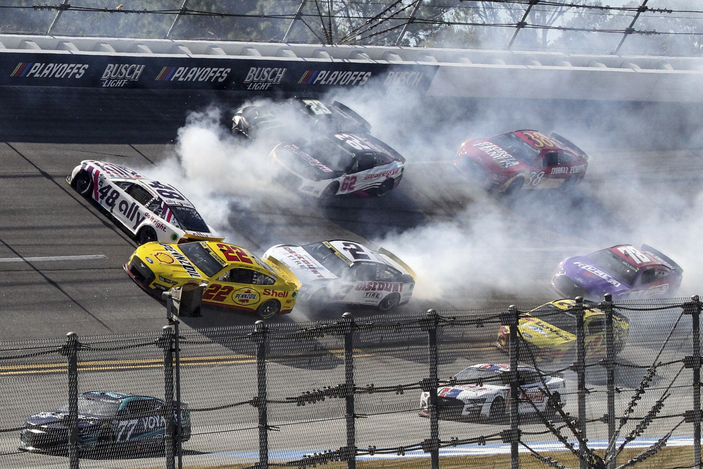 Alex Bowman (48), Joey Logano (22), Austin Cindric (2), Justin Allgaier (62) and Ty Gibbs (23) are involved in a crash in Turn 1 during a NASCAR Cup Series auto race Sunday, Oct. 2, 2022, in Talladega, Ala. 