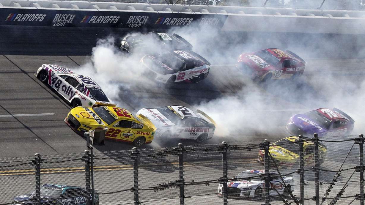 Alex Bowman (48), Joey Logano (22), Austin Cindric (2), Justin Allgaier (62) and Ty Gibbs (23) are involved in a crash in Turn 1 during a NASCAR Cup Series auto race Sunday, Oct. 2, 2022, in Talladega, Ala.