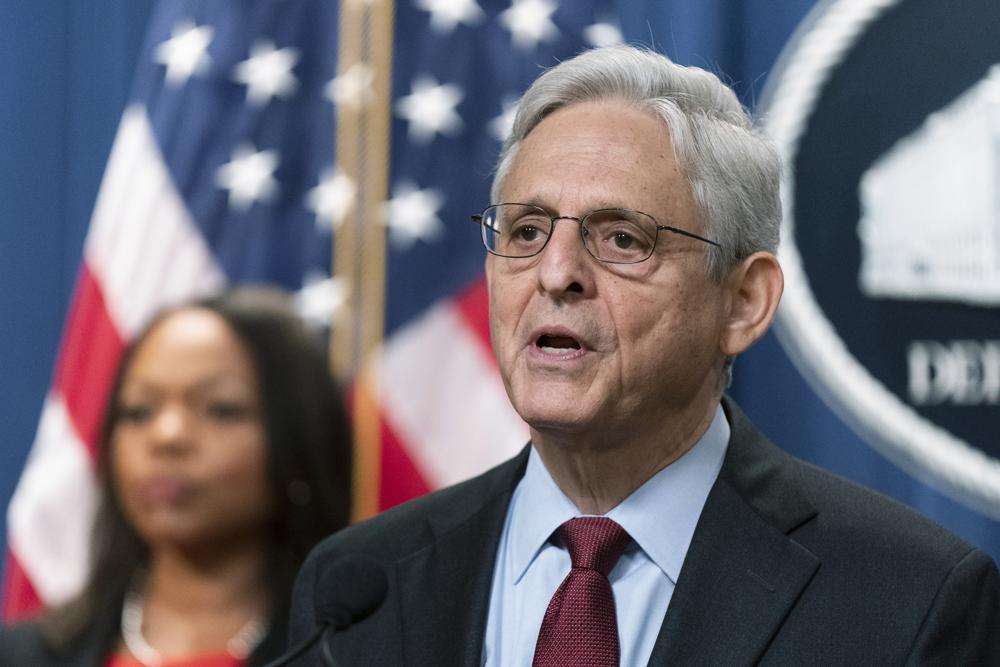 Attorney General Merrick Garland with Assistant Attorney General Kristen Clarke for the Civil Rights Division, speaks during a news conference at the Department of Justice in Washington, Aug. 4. Recent revelations about the search warrant that led to Breonna Taylor’s death have reopened old wounds in Louisville’s Black community and disrupted the city’s efforts to restore trust in the police department.