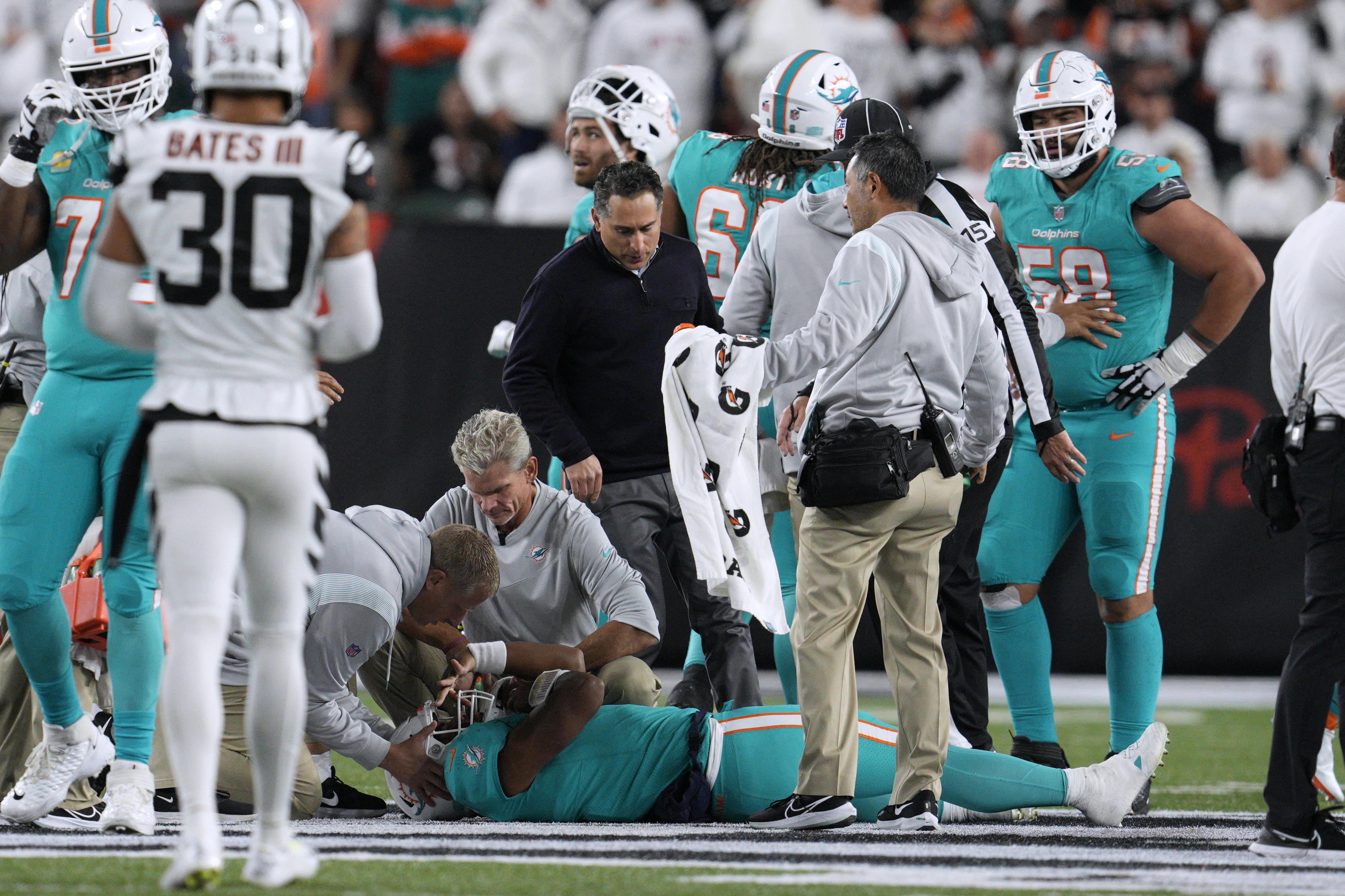 Miami Dolphins quarterback Tua Tagovailoa is examined during the first half of the team's NFL football game against the Cincinnati Bengals, Thursday, Sept. 29, 2022, in Cincinnati. 