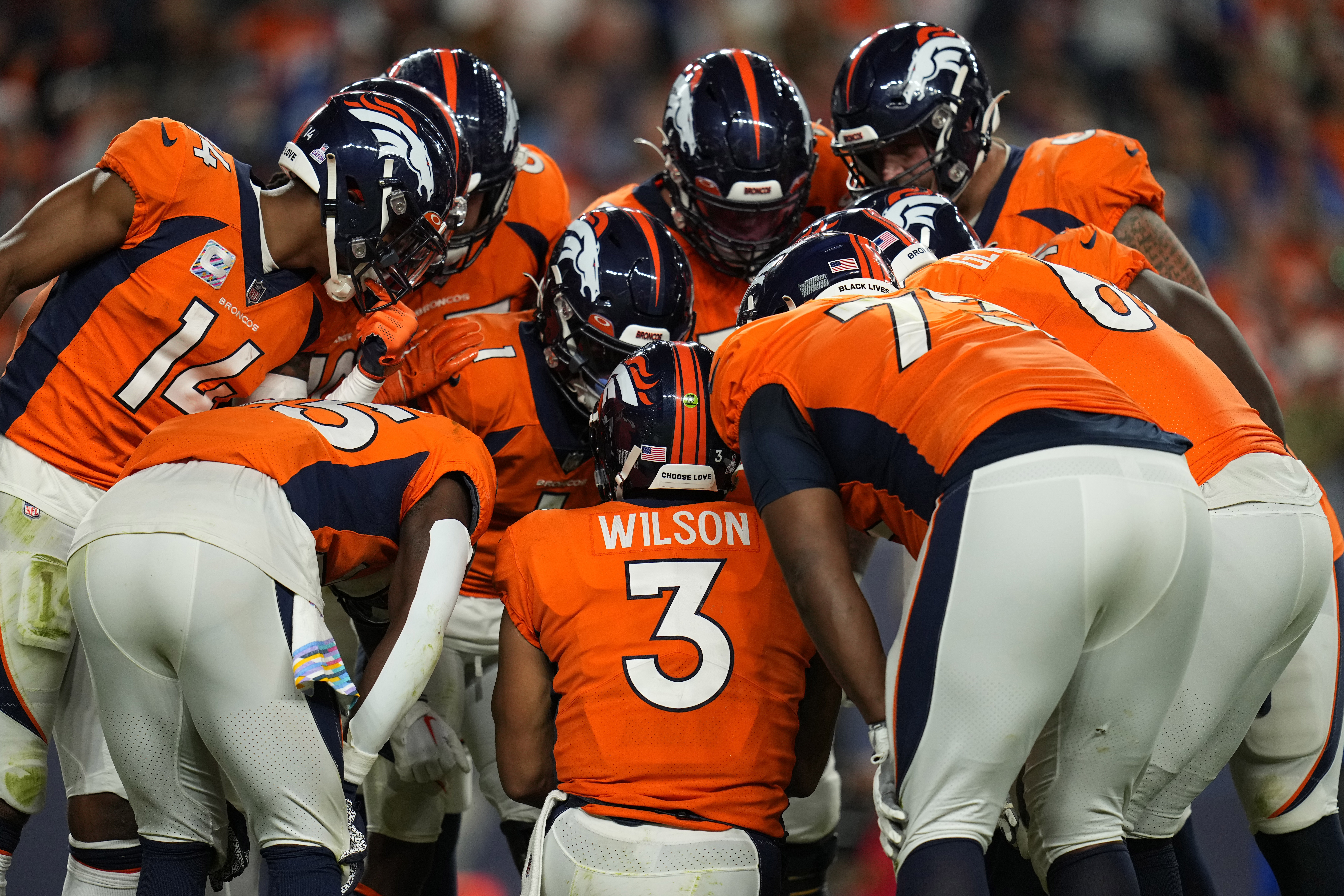 Denver Broncos quarterback Russell Wilson (3) huddles up his team during the second half of an NFL football game against the Indianapolis Colts, Thursday, Oct. 6, 2022, in Denver.