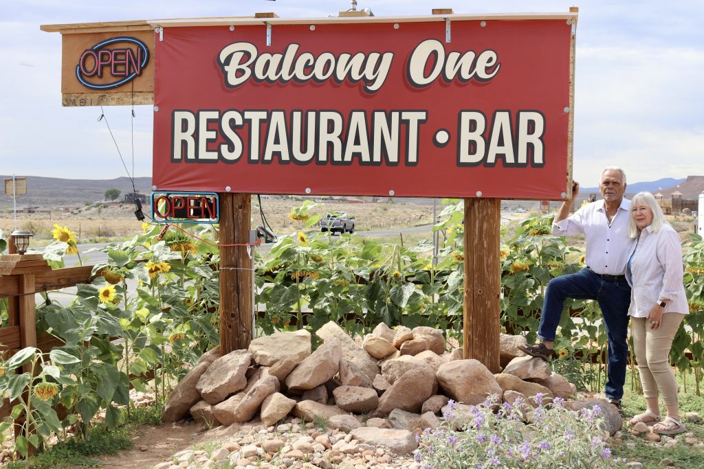 Balcony One owners George and Cindy Rodinos pose in front of their restaurant sign, Virgin, Utah, Sept. 28.