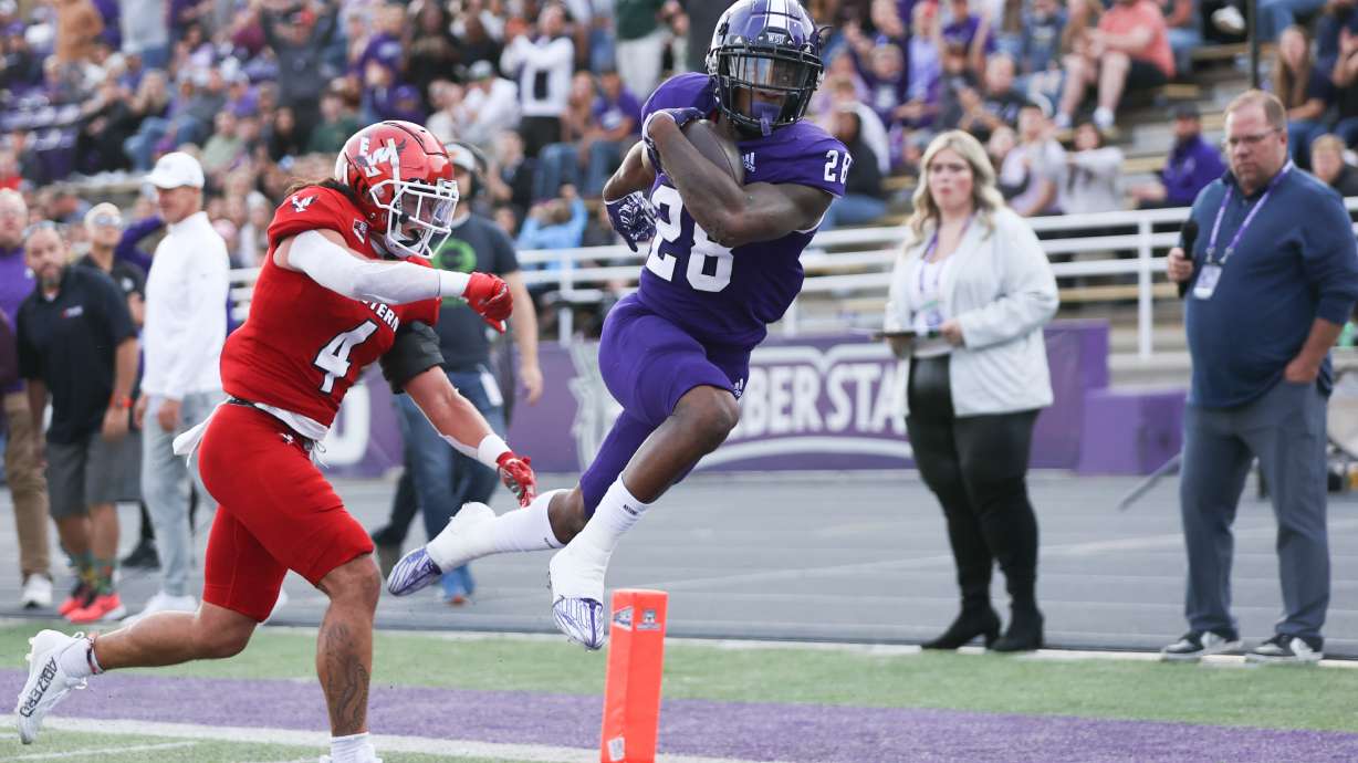 Weber State running back Dontae McMillan scores a touchdown against Eastern Washington in a game the Wildcats won, 45-21, on Oct. 8, 2022.