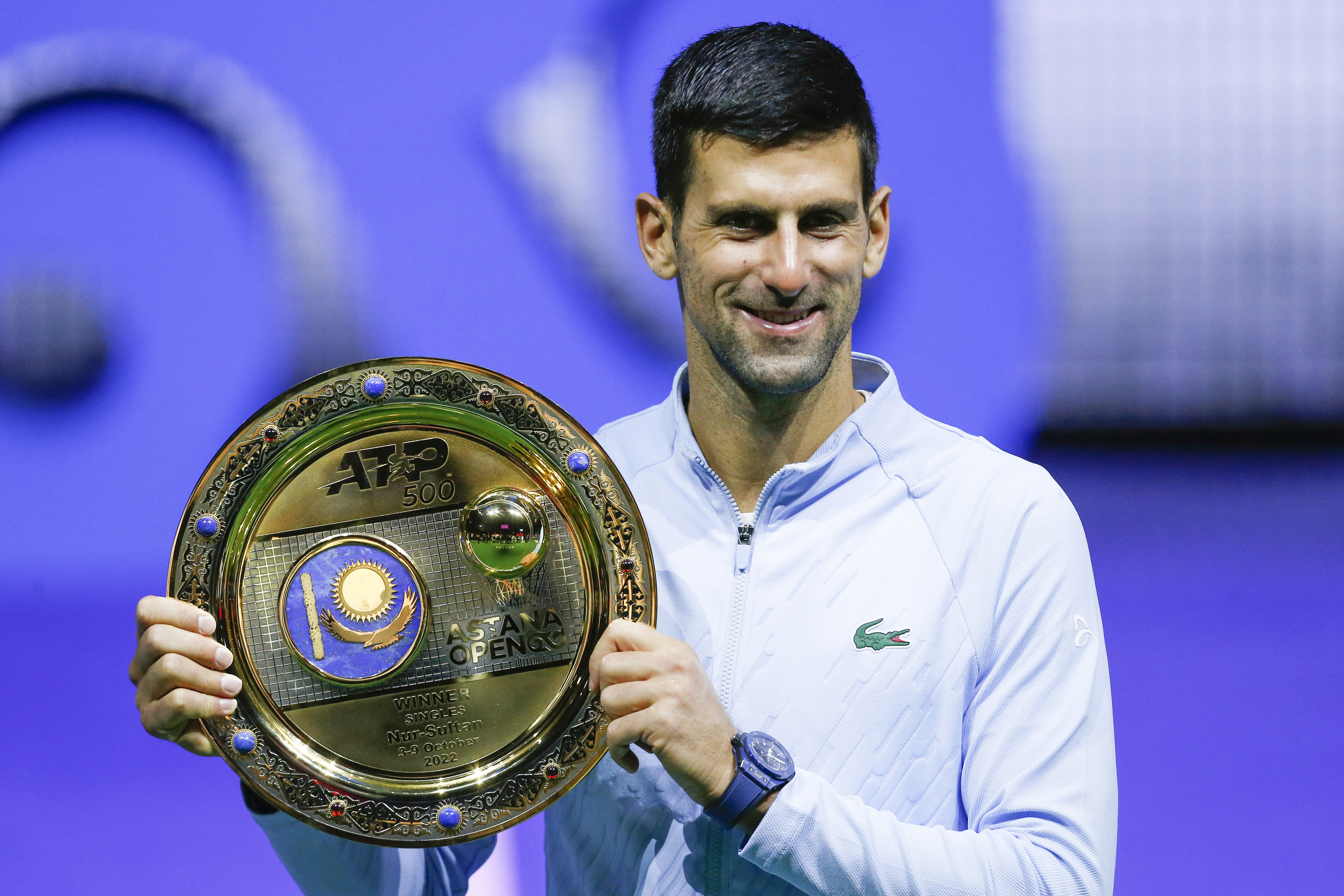 Serbia's Novak Djokovic poses with the trophy after winning the final tennis match of the ATP 500 Astana Open tennis tournament against Stefanos Tsitsipas of Greece in Astana, Kazakhstan, Sunday, Oct. 9, 2022. 