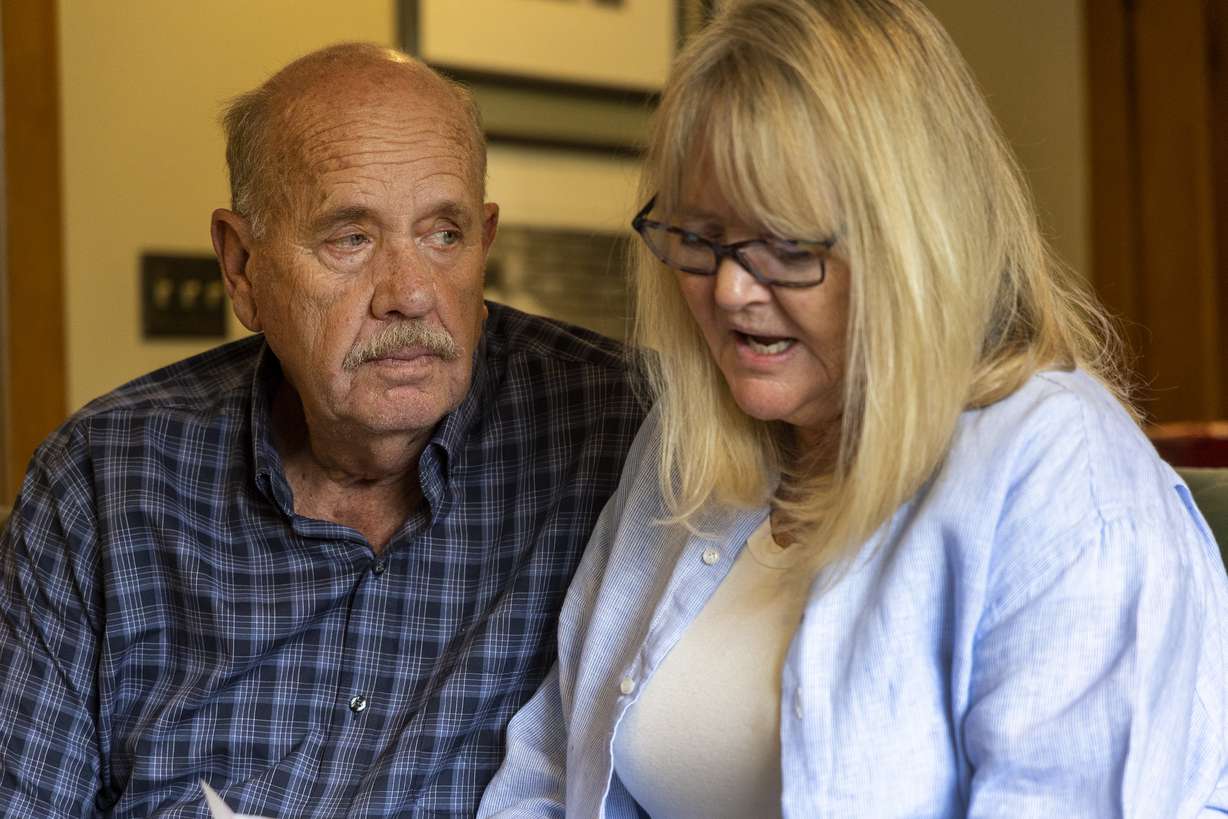 Ron Snarr looks at his wife, Sy, as she reads a letter from Jorge Benvenuto, who murdered their son, Zachary Snarr, in August 1996, on Friday, Aug. 19, at their home in Salt Lake City.