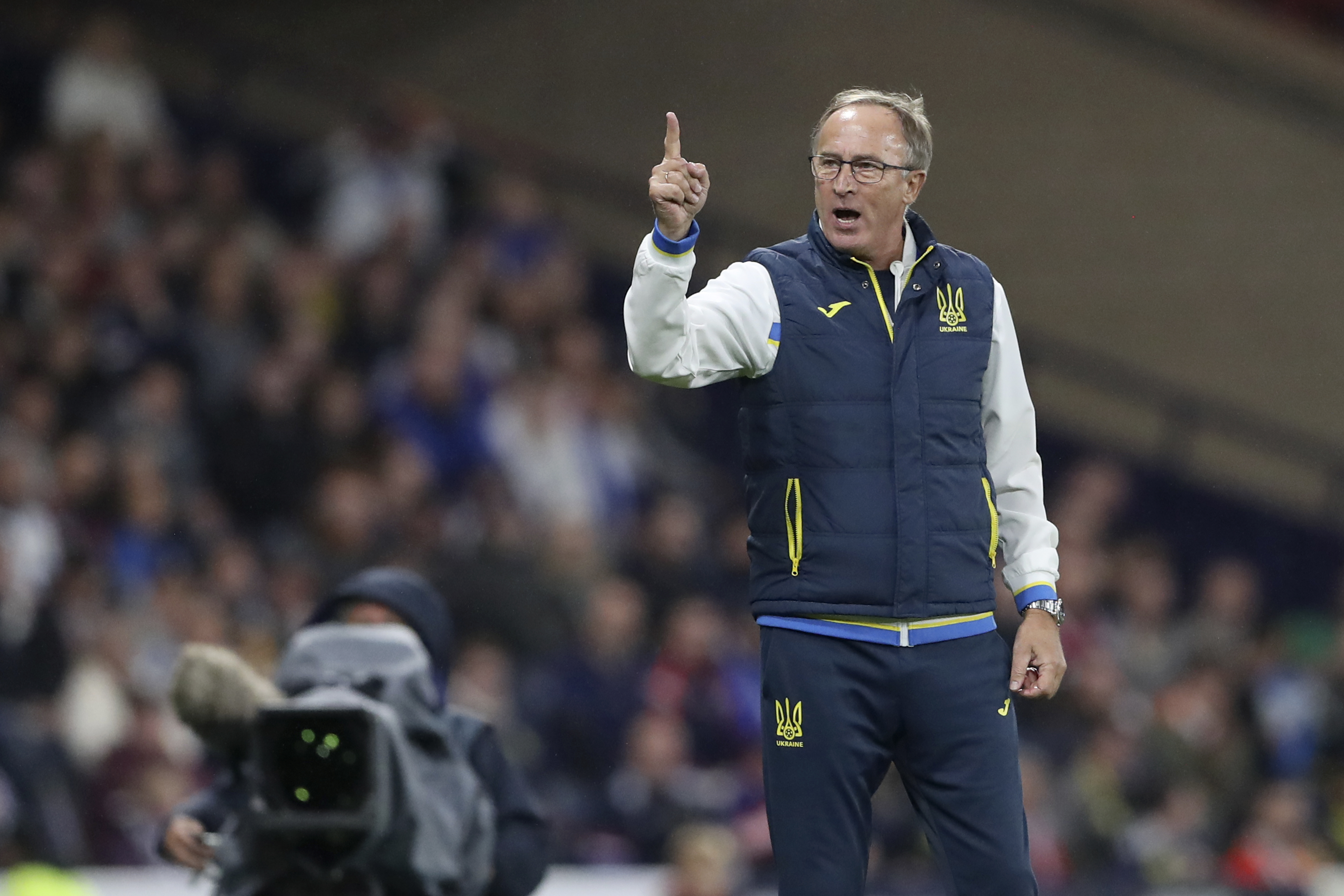 Ukrainian head coach Oleksandr Petrakov gestures during the UEFA Nations League soccer match between Scotland and Ukraine, at Hampden Park, in Glasgow, Scotland, Wednesday, Sept. 21, 2022. 