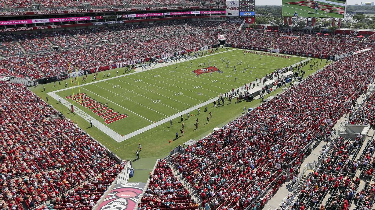 FILE - The Miami Dolphins and Tampa Bay Buccaneers play an NFL football game at Raymond James Stadium in Tampa, Fla., Oct. 10, 2021. A boy ran onto the field and was tackled hard by a security guard in the second quarter of Tampa Bay’s game against Atlanta at Raymond James Stadium in Tampa, Fla., Sunday, Oct. 9, 2022. A woman who identified herself as the child’s mother told The Associated Press the boy is 10 years old. A police officer later told the AP the boy is older than 10, but he couldn't release his information because he's a juvenile.