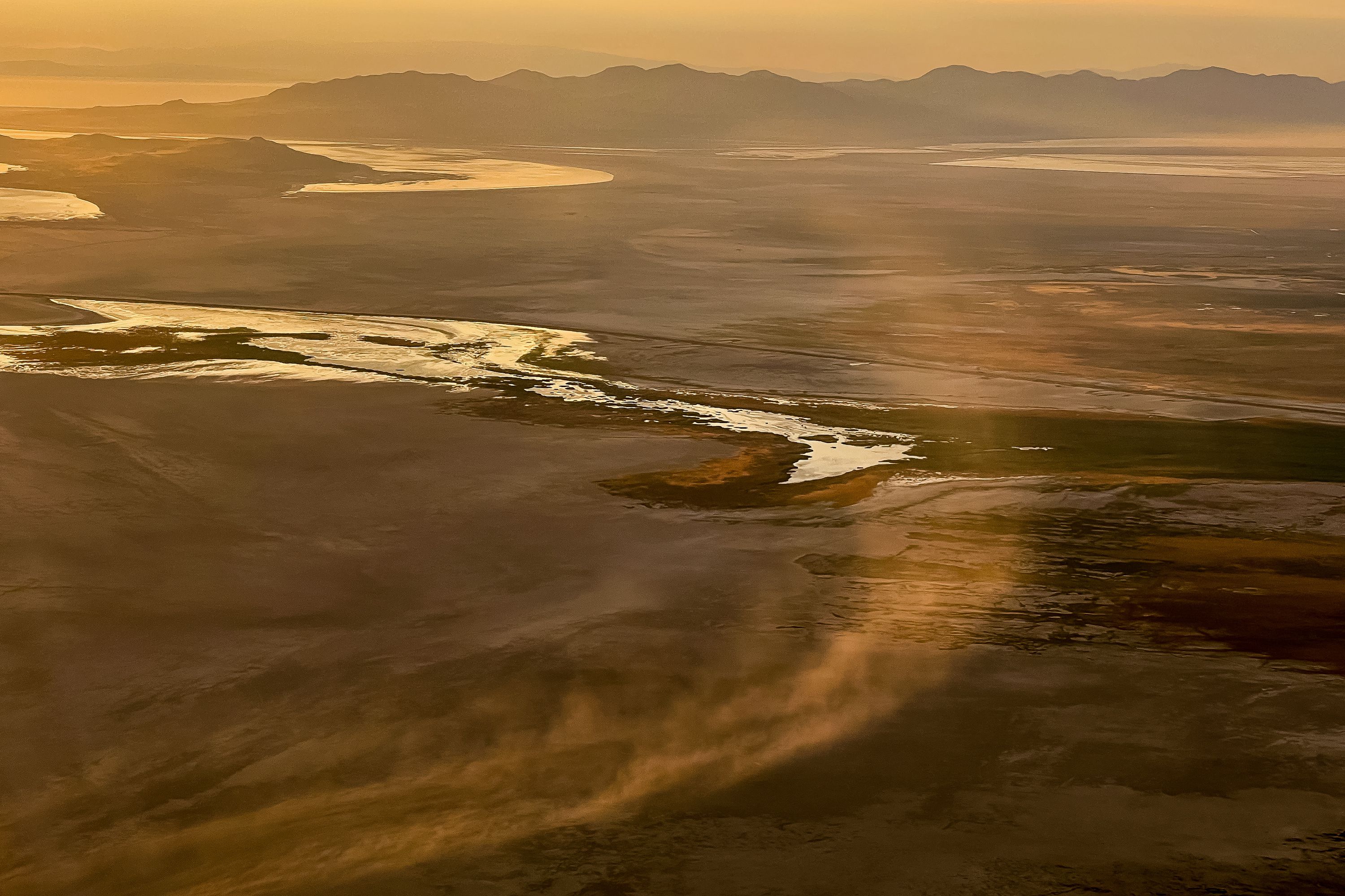 Dust blows across the dry lakebed of the Great Salt Lake near Salt Lake City on Friday, Aug. 12.
