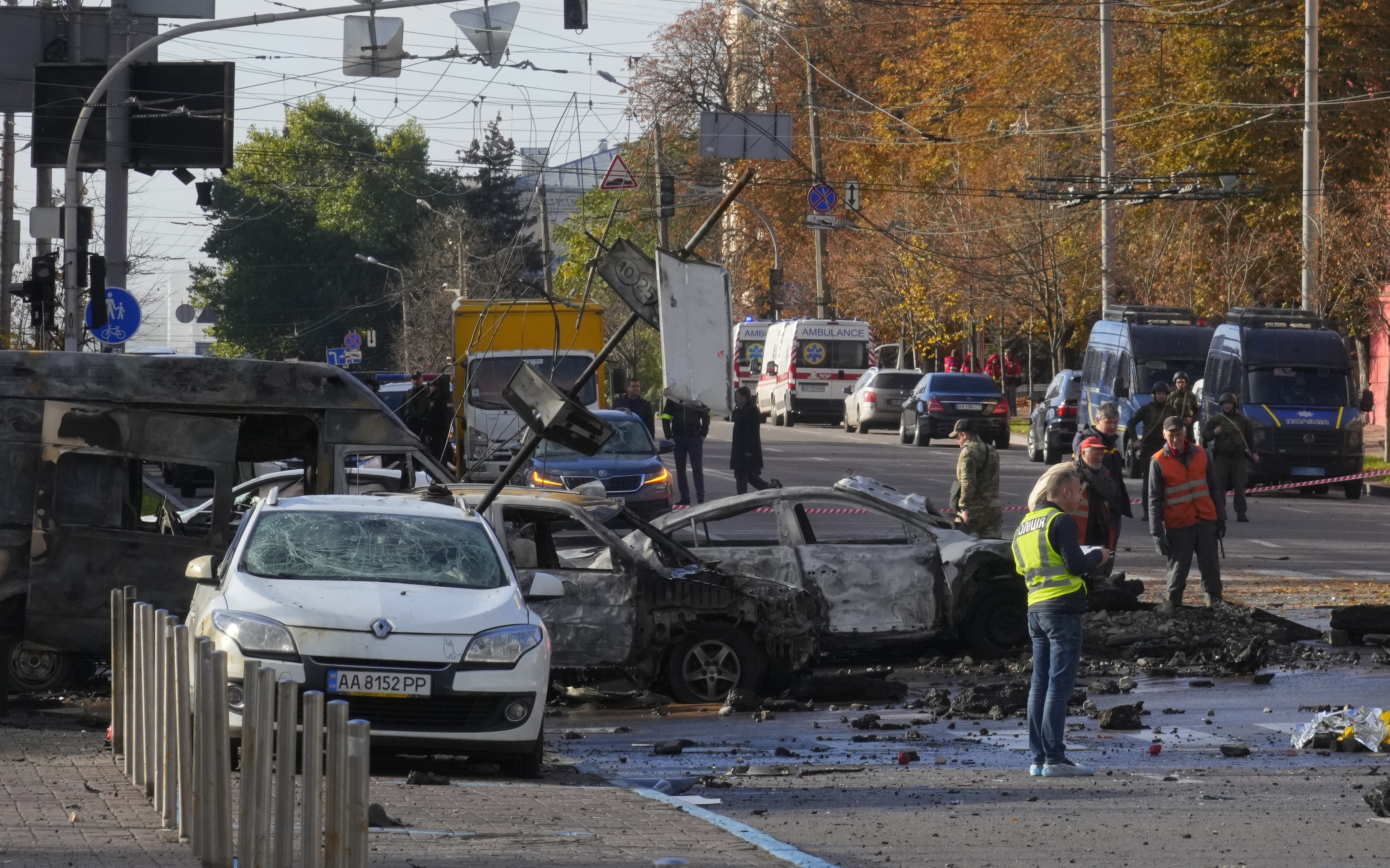 Police inspect the scene of Russian shelling in Kyiv, Ukraine, Monday. Two explosions rocked Kyiv early Monday following months of relative calm in the Ukrainian capital.