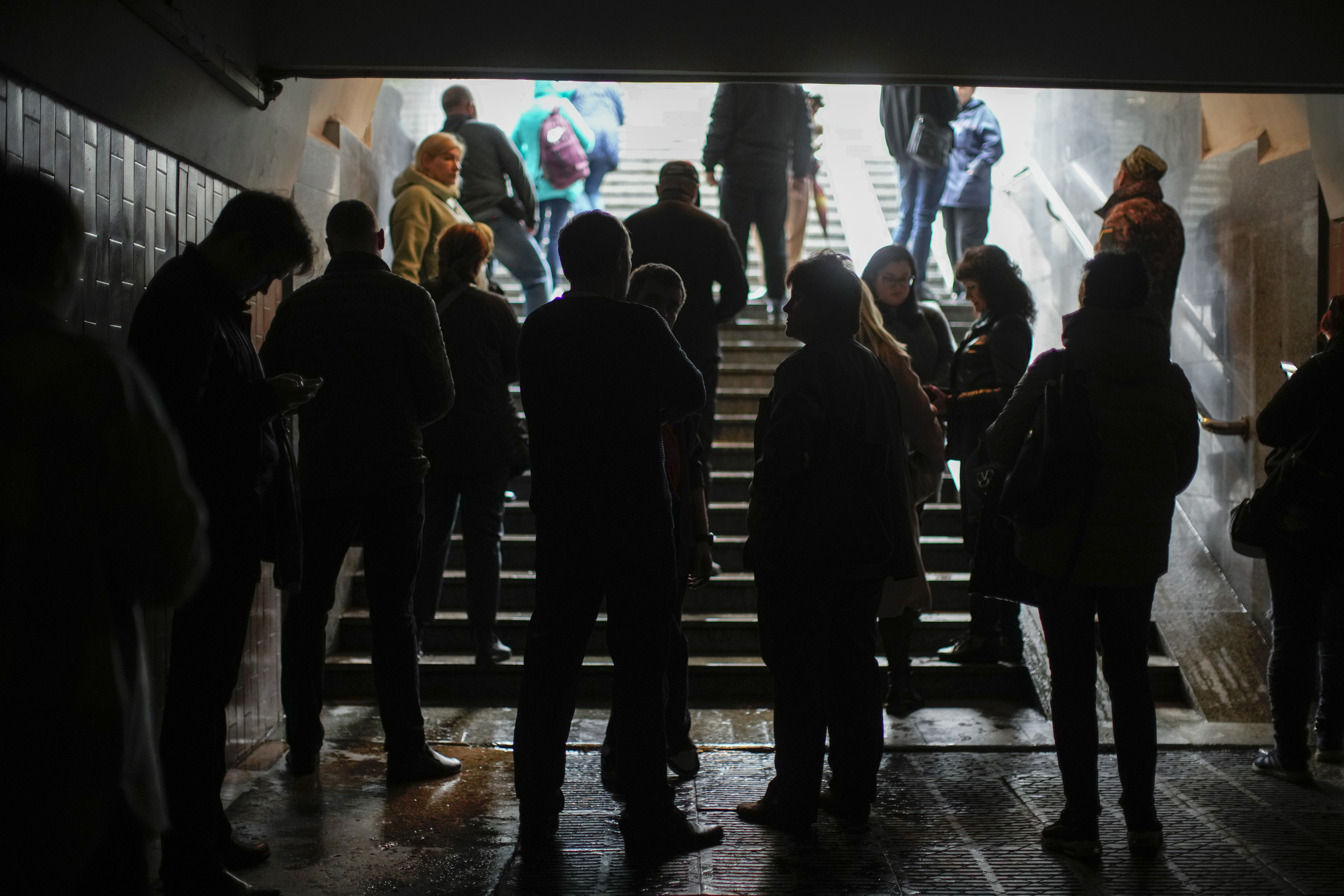 People shelter in a subway station after a Russian shelling in Kharkiv, Ukraine, Monday. Explosions on Monday rocked multiple cities across Ukraine, including missile strikes on the capital Kyiv for the first time in months.
