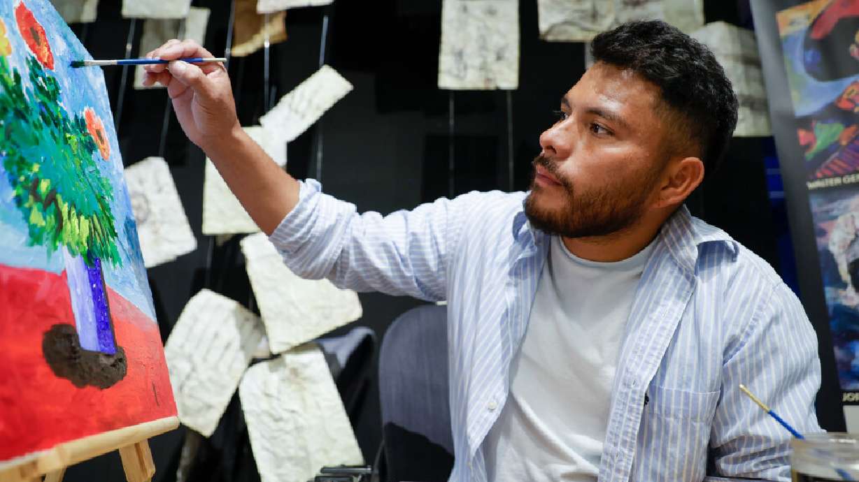 Walter Cifuentes García paints at The Leonardo in Salt Lake City on Saturday. Cifuentes is one of six artists in residence at the museum. The artists in residence program highlights Latino artists who cover a range of mediums, experience and backgrounds.