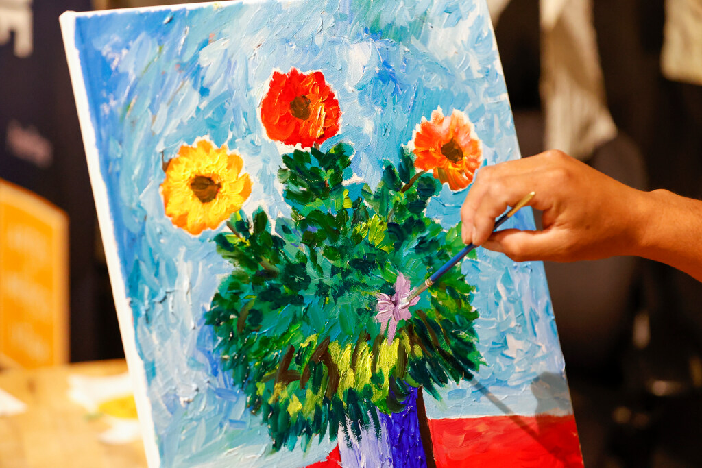 Walter Cifuentes García paints at The Leonardo in Salt Lake City on Saturday.