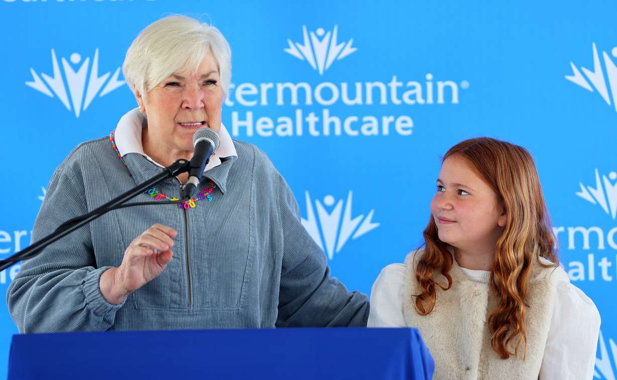 Gail Miller stands with Harper Morgan, who is a patient at Primary Children’s Hospital, as they announce a major donation from the Todd and Andie Pedersen family to help support an initiative to build the nation’s model health system for children on Monday in Lehi at the construction site for the new hospital.