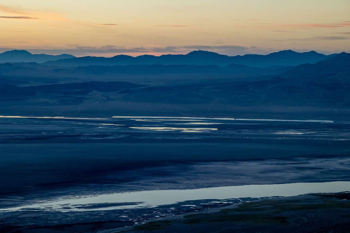 The mostly dry lakebed of Owens Lake, as well as some natural pools of water and areas that have been flooded as part of the Owens Lake Dust Mitigation Program, are pictured before sunrise in Inyo County, California, on Aug. 12.
