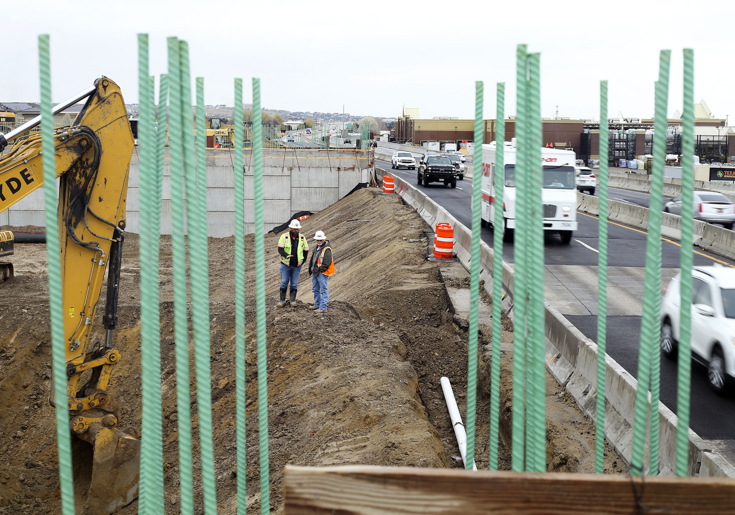 Traffic moves through the construction zone for the Bangerter Highway interchange at 12600 South in Riverton on April 15, 2021. Riverton Mayor Trent Staggs argues that the highway's growth won't be enough to help transportation needs in southwest Salt Lake County in the future, which is why he's calling for more alternative transportation options.
