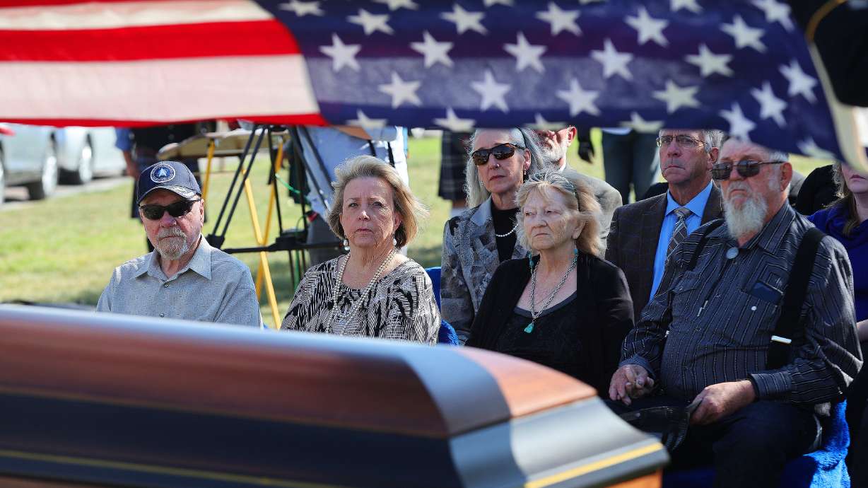 Frank and Kristie Moe, left, and Kayce and Joe Phillips attend the graveside services for U.S. Army Air Force Sgt. Elvin L. Phillips at Utah Veterans Cemetery and Memorial Park in Bluffdale on Tuesday. Phillips was killed during World War II after being shot down in a B-24 Liberator over Romania. Phillips remains were just recently identified.