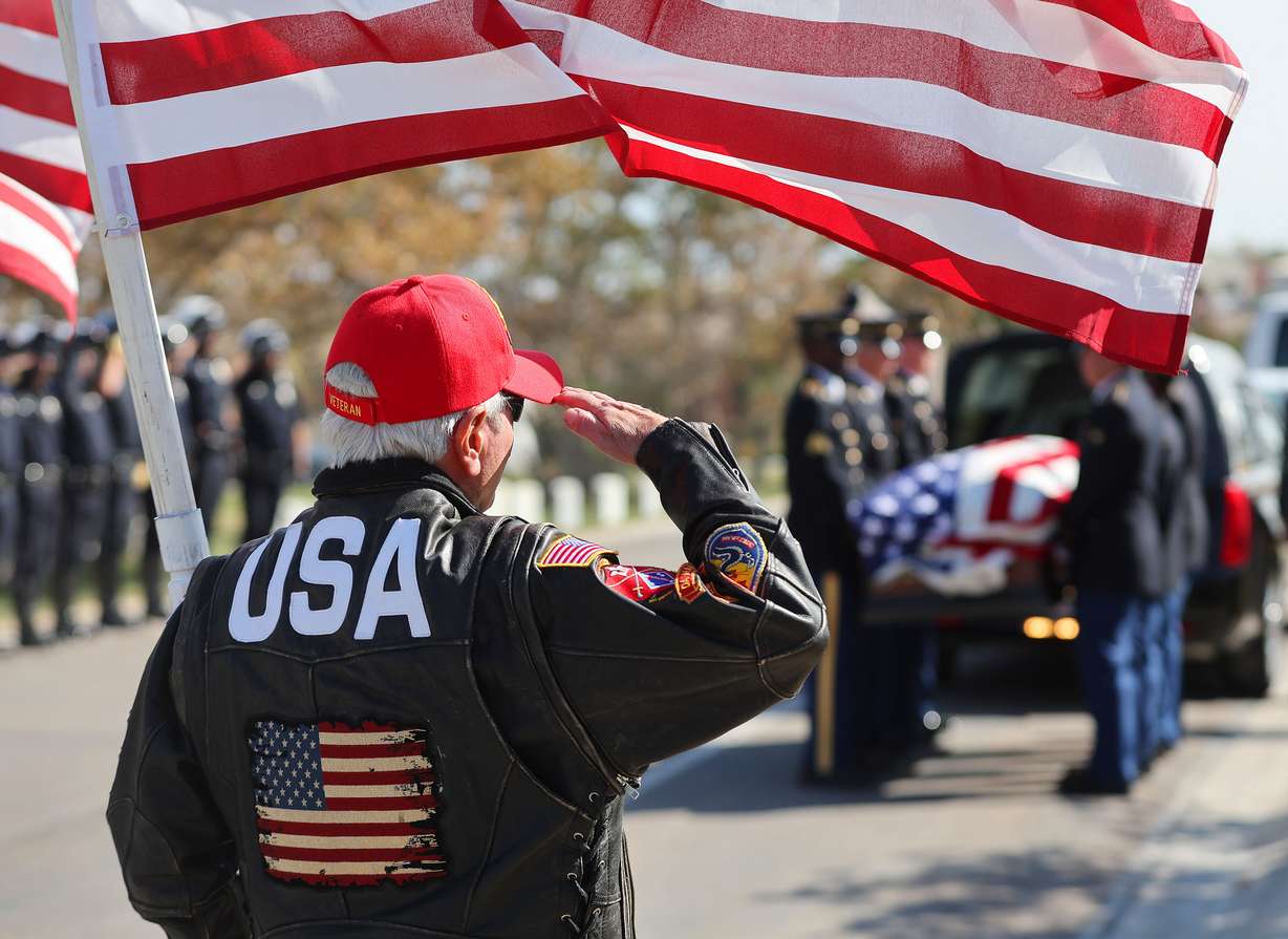 Freedom Rider Bob Nosack salutes during graveside services for U.S. Army Air Forces Sgt. Elvin L. Phillips at Utah Veterans Cemetery and Memorial Park in Bluffdale on Tuesday. Phillips was killed during World War II after being shot down in a B-24 Liberator over Romania. Phillips remains were identified using anthropological, mitochondrial DNA, Y chromosome DNA, and autosomal DNA analysis.