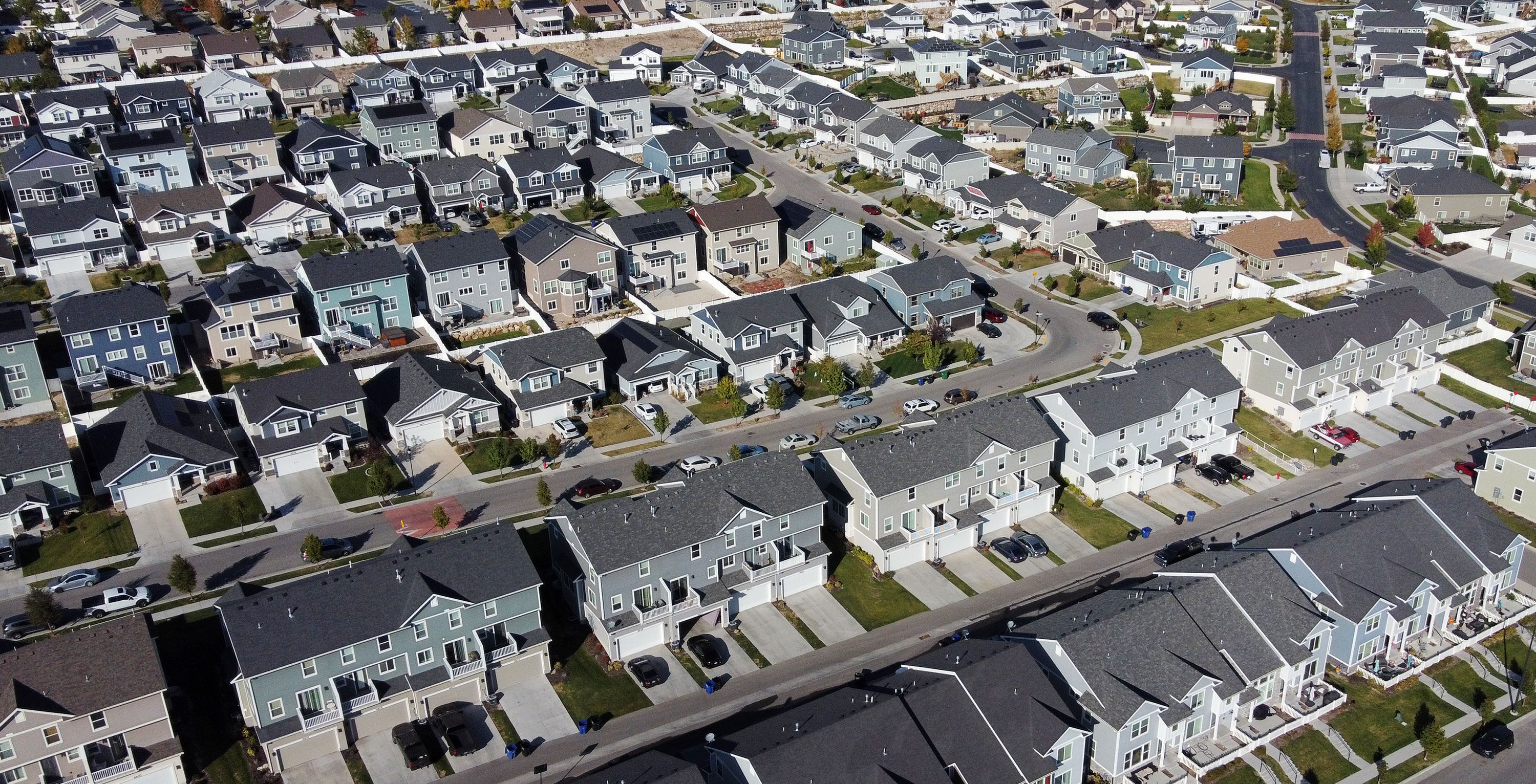 Homes are seen in West Jordan on Monday. Big banks and other investment firms all agree the U.S. housing market is in the middle of a major slowdown — but they vary when it comes to their forecasts on what this market correction will mean for U.S. home prices.