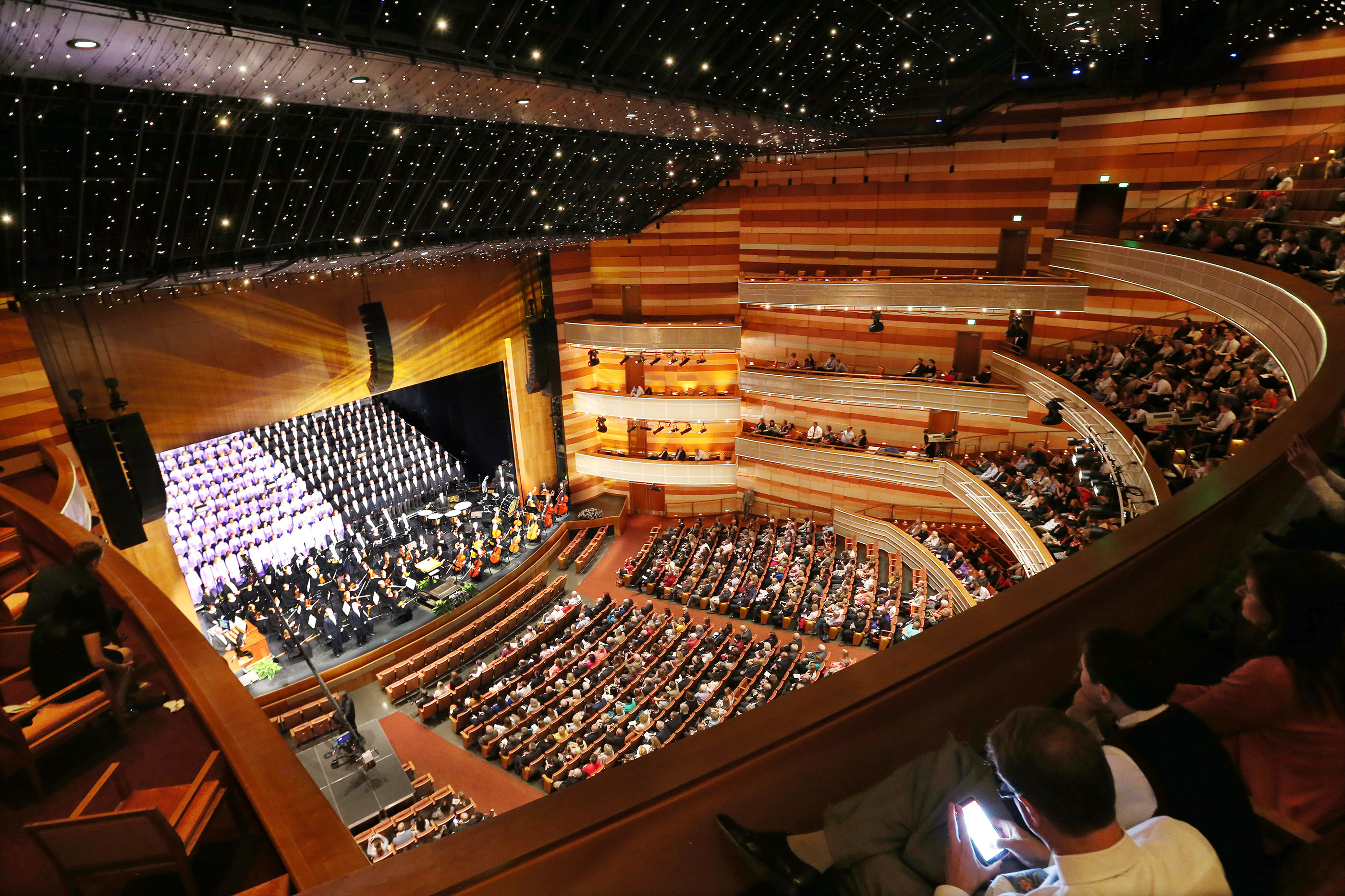 Members of the Tabernacle Choir at Temple Square sing on Sunday, Oct. 23, 2016, a part of the theater's opening weekend. The theater has brought in a net income every year since it opened, except for 2020.