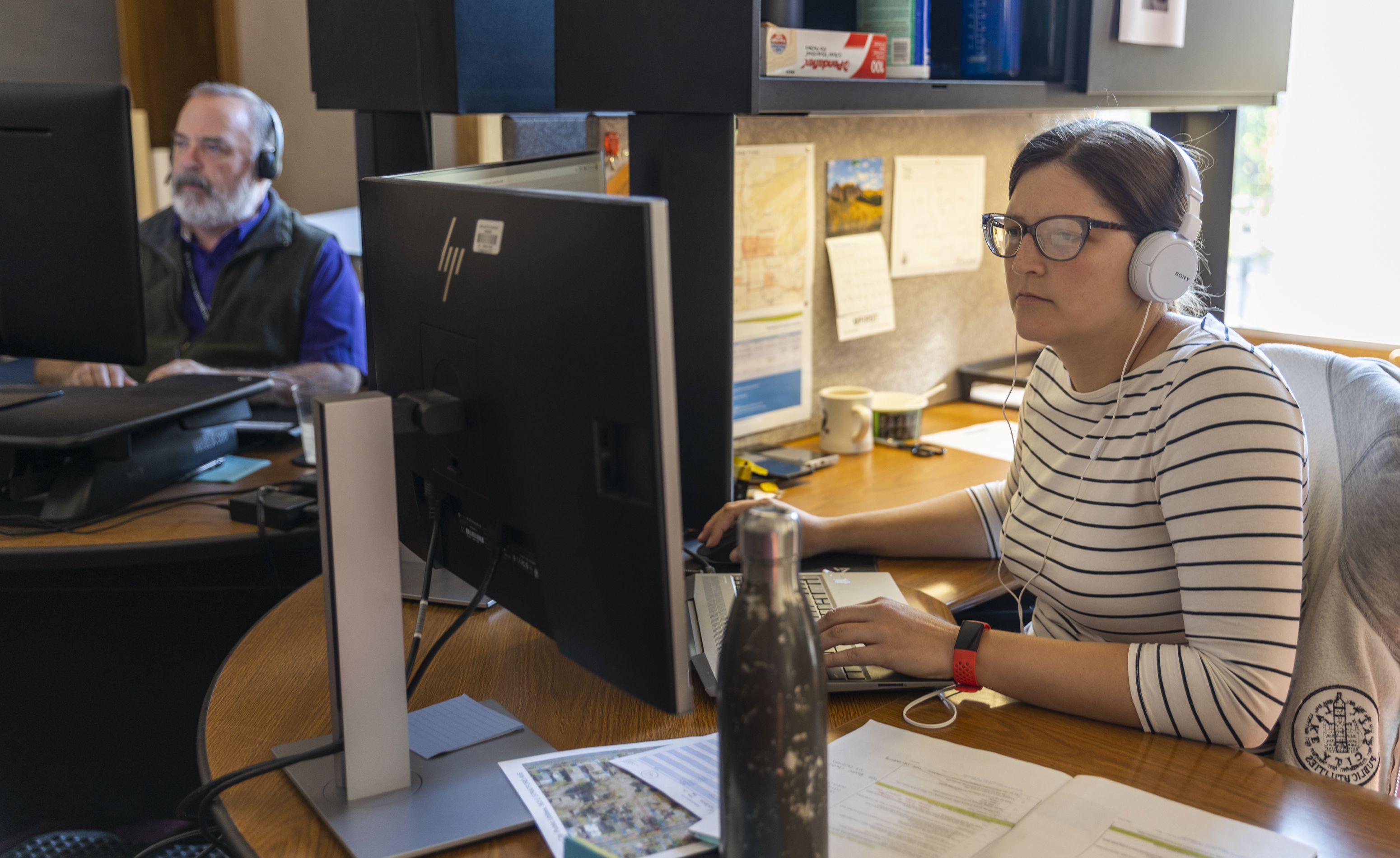 Andrea Osojnak, an Engineer IV, works at her desk inside of the Salt Lake City and County Building in Salt Lake City on Tuesday. Seismic impacts on the function and philosophy of where we do our work, first wrought by COVID-19 pandemic restrictions, continue to be felt by business owners and employees as new definitions of the workplace are still being written.