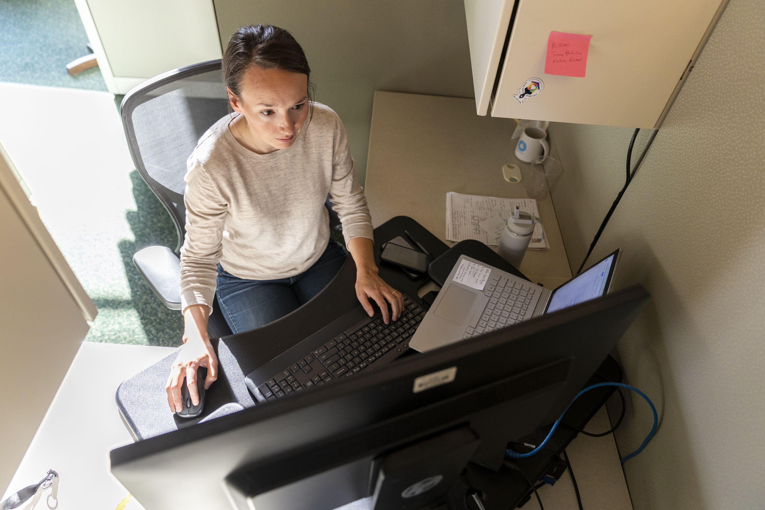 Katie Riser, Special Project and Volunteer Program Manager, works at her desk inside of the Salt Lake City and County Building in Salt Lake City on Tuesday.
