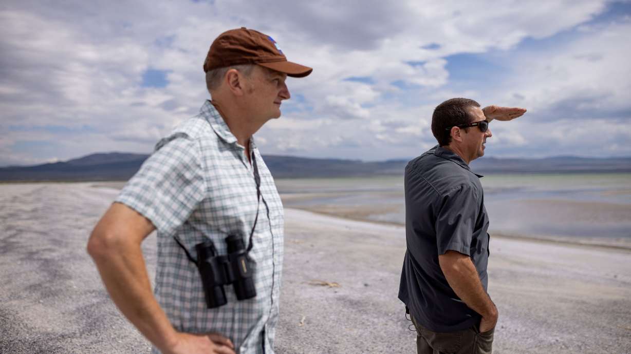Geoffrey McQuilkin, executive director of the Mono Lake Committee, and Phill Kiddoo, air pollution control officer for the Great Basin Unified Air Pollution Control District, take journalists on a tour of the north shore of Mono Lake in Mono County, Calif., on Aug. 9.