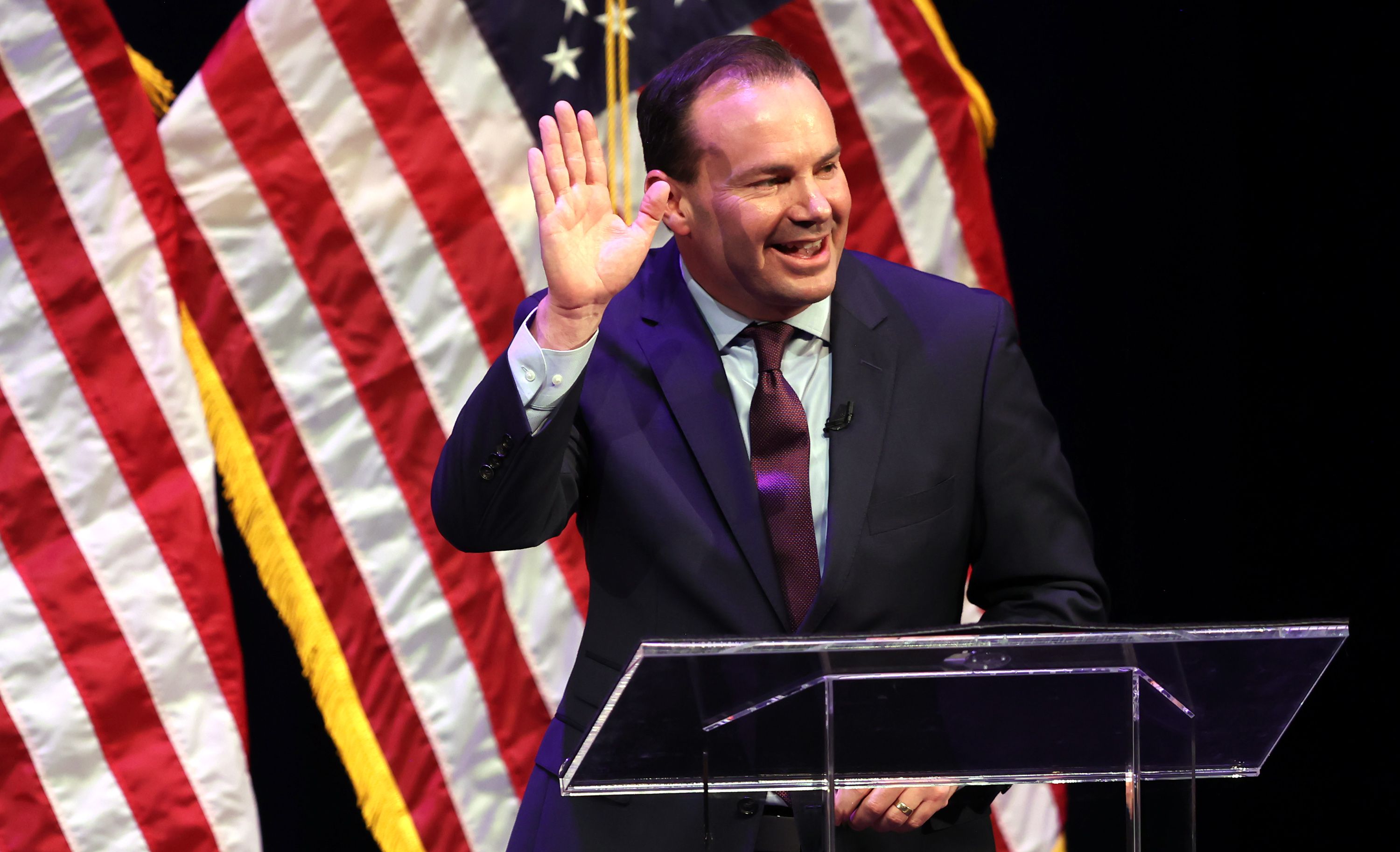 Sen. Mike Lee waves at a Utah GOP sponsored debate at Draper Park Middle School in Draper on June 1. Mike Lee is up for reelection to the U.S. Senate. Lee pleaded with fellow Utah Republican Sen. Mitt Romney to endorse him and get his family to send money to his reelection campaign on Fox News Tuesday night.