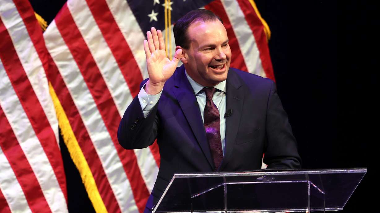 Sen. Mike Lee waves at a Utah GOP sponsored debate at Draper Park Middle School in Draper on June 1. Mike Lee is up for reelection to the U.S. Senate. Lee pleaded with fellow Utah Republican Sen. Mitt Romney to endorse him and get his family to send money to his reelection campaign on Fox News Tuesday night.