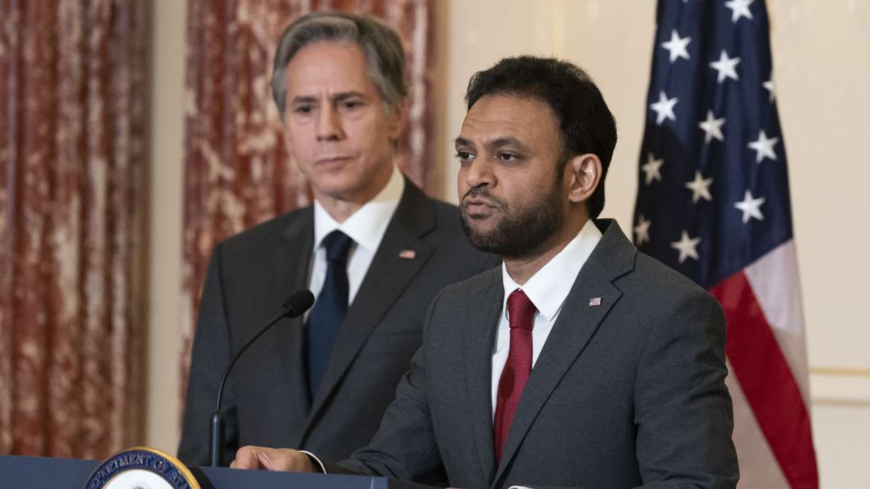 Secretary of State Antony Blinken, left, listens as Ambassador at Large for International Religious Freedom Rashad Hussain speaks on the release of the 2021 International Religious Freedom Report, at the State Department, on June 2, in Washington.