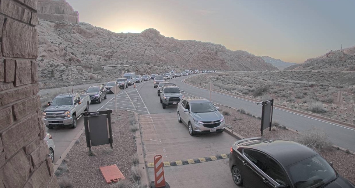 Security camera footage of a long vehicle line outside of Arches National Park after 7:30 a.m. on March 25. Park officials have temporarily closed off entry to the park every day since Oct. 4 because parking lots have filled up.