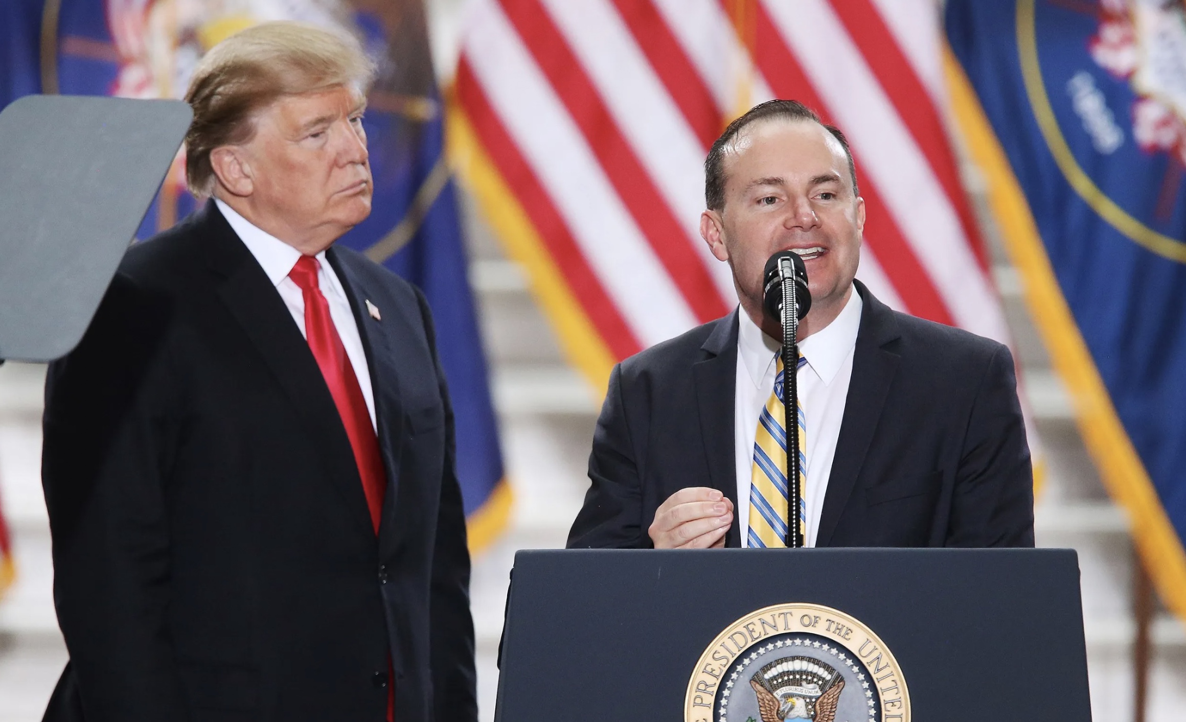 Sen. Mike Lee, R-Utah, speaks as President Donald Trump looks on at the Capitol in Salt Lake City on Dec. 4, 2017. Trump weighed in on Lee’s reelection bid this week.