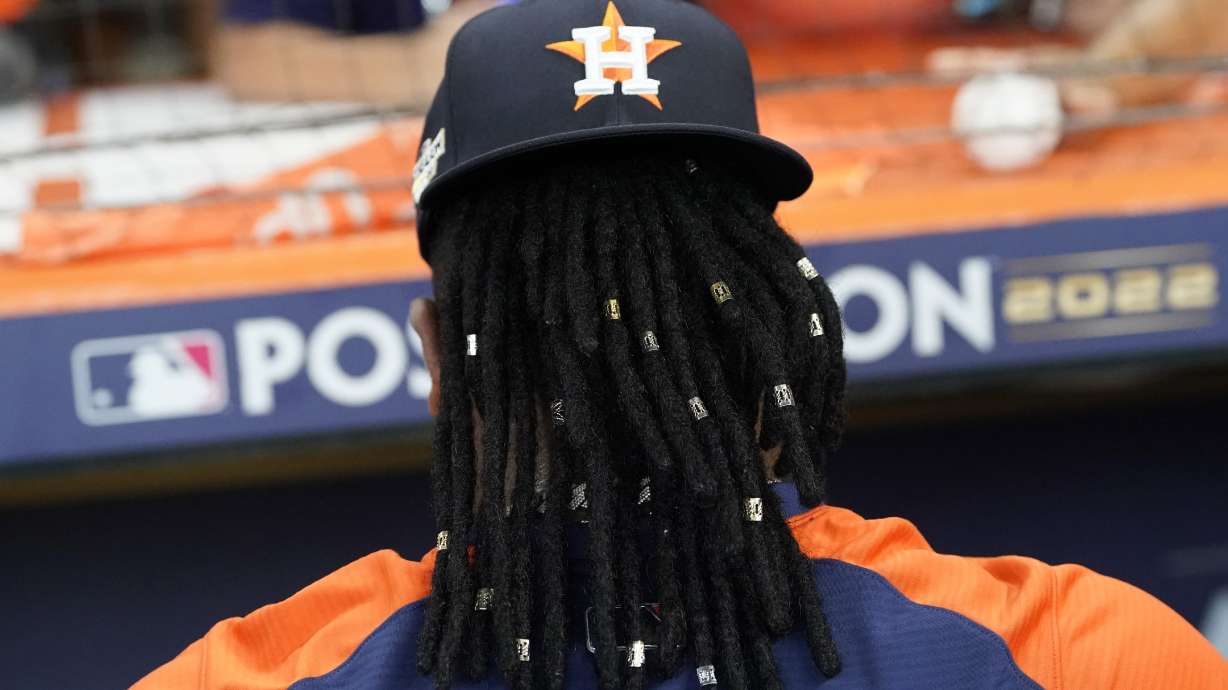 Houston Astros pitcher Framber Valdez signs autographs before Game 1 of an American League Division Series baseball game against the Seattle Mariners in Houston, Tuesday, Oct. 11, 2022. Valdez and teammate Luis Garcia got hair extensions this season and will show off their unique locks this postseason as Houston tries to reach the World Series for the fourth time in six years.