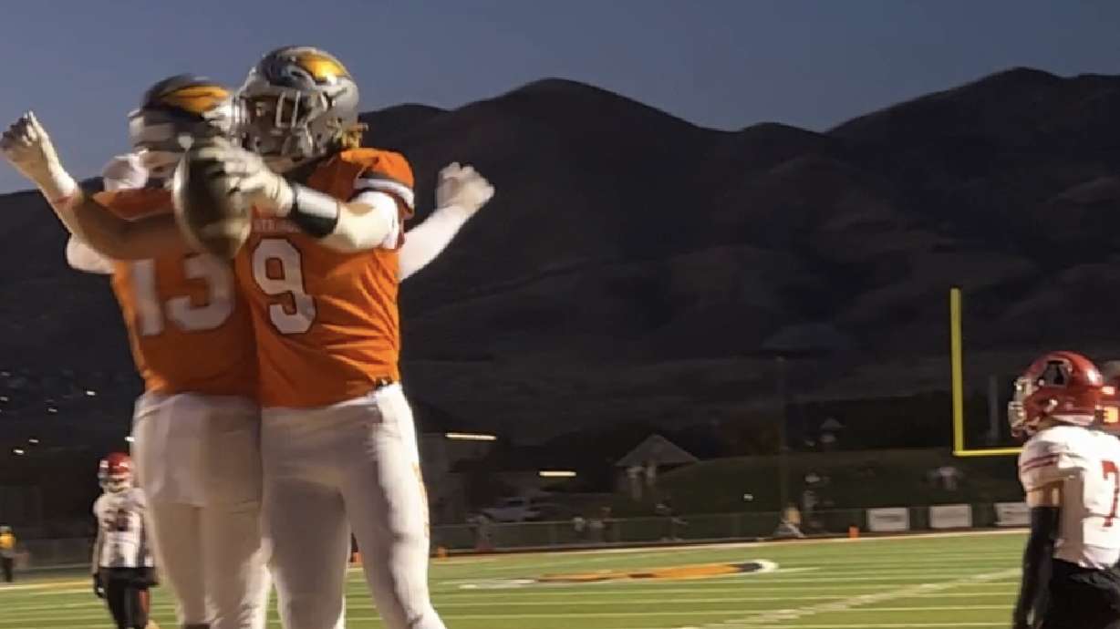 Skyridge's Josh Davis (9) celebrates a touchdown in the first quarter of the Falcons' 37-0 win over American Fork in the regular-season finale, Wednesday, Oct. 12, 2022 in Lehi.
