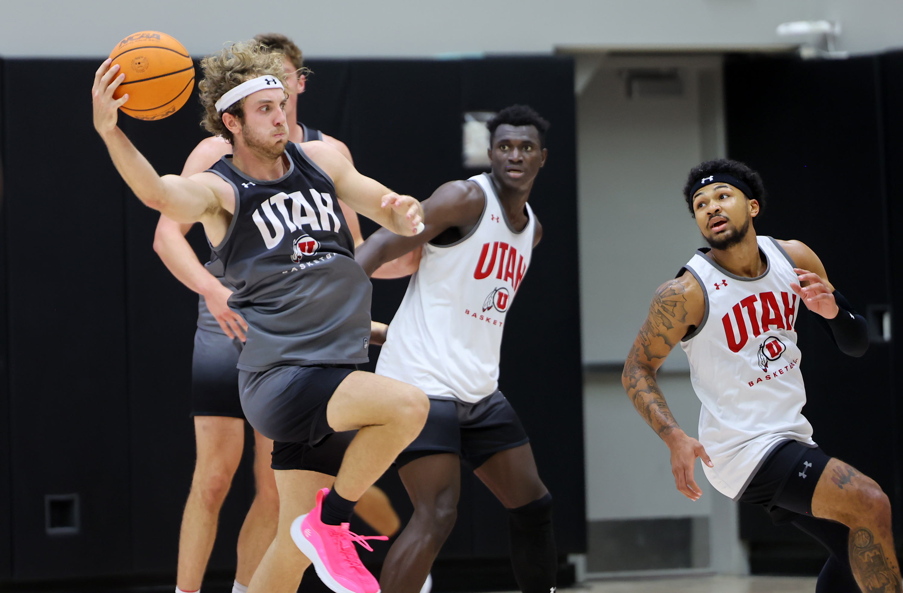 Jaxon Brenchley grabs a pass as the University of Utah Men’s Basketball team opens camp with practice in the Jon M. and Karen Huntsman Basketball Facility in Salt Lake City on Monday, Sept. 26, 2022.