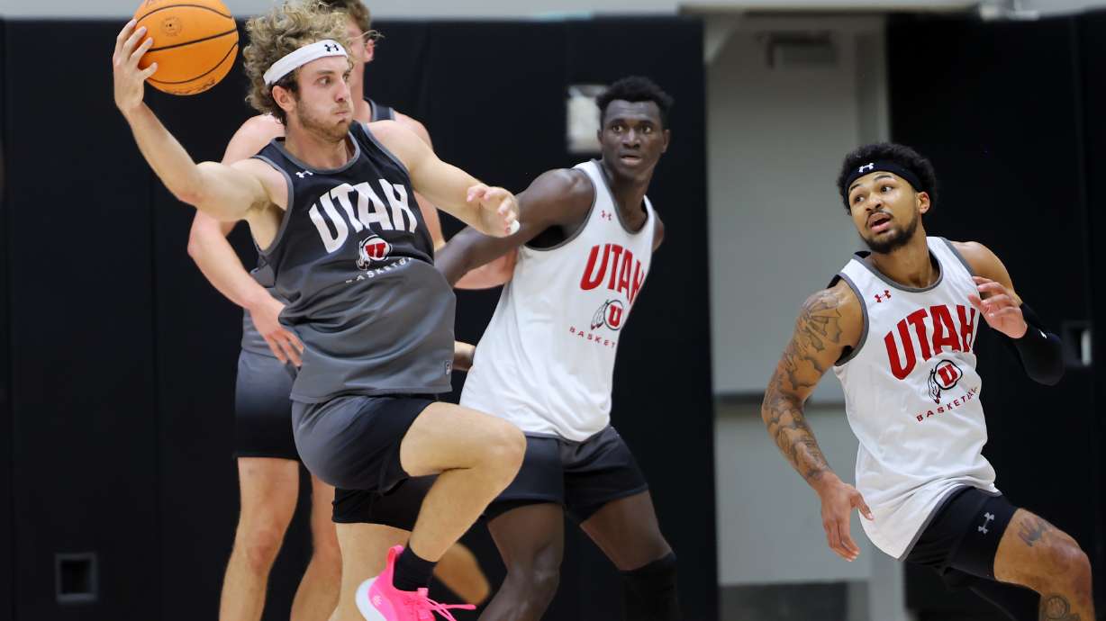 Jaxon Brenchley grabs a pass as the University of Utah Men’s Basketball team opens camp with practice in the Jon M. and Karen Huntsman Basketball Facility in Salt Lake City on Monday, Sept. 26, 2022.