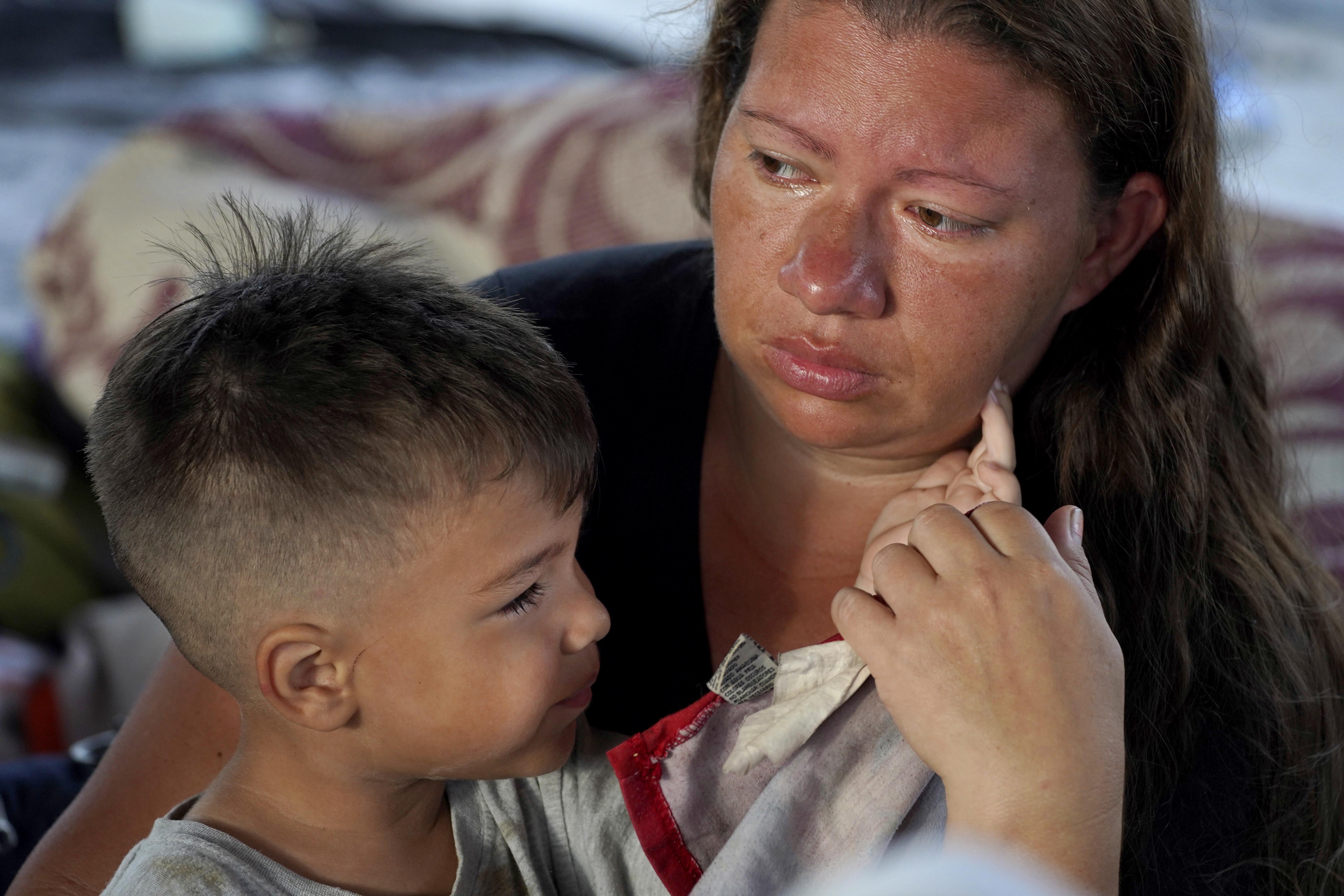 Venezuelan Jenny Villamizar and her 3-year-old, Santiago, who are part of a migrant caravan, sit at a sports complex turned into a makeshift shelter, in Huixtla, Chiapas state, Mexico, on June 8. The mother and son are part of an extended family of 18, including eight children, who traveled from Venezuela to Mexico’s southern border in 15 days. Venezuelans make up a large proportion of this caravan, the biggest of the year, in contrast to others in previous years.