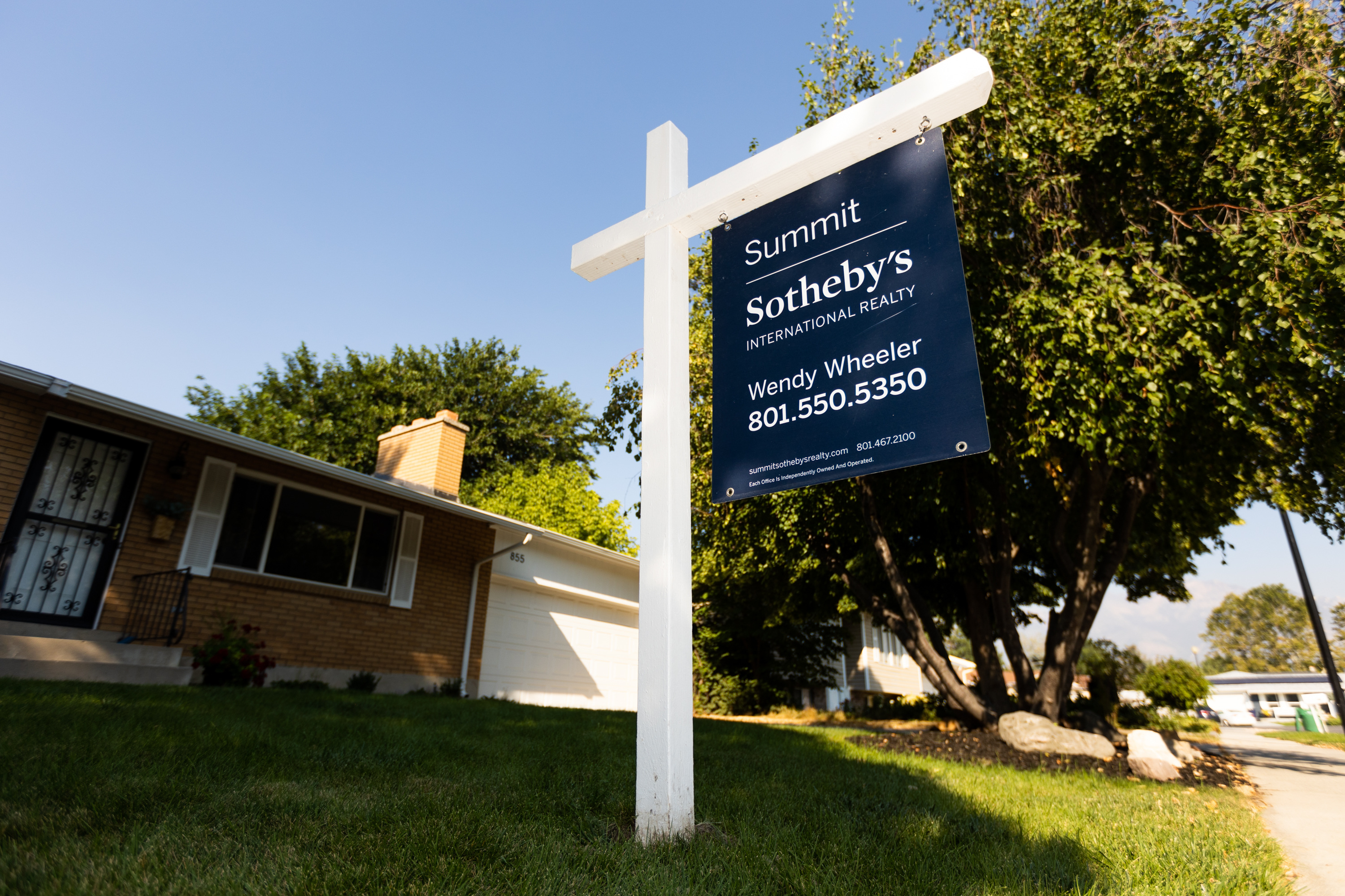 A “For Sale” sign stands in front of a home in Sandy on Sept. 9. According to both Fortune and Bloomberg, professional home flippers are in trouble again with the current real estate market and higher interest rates.