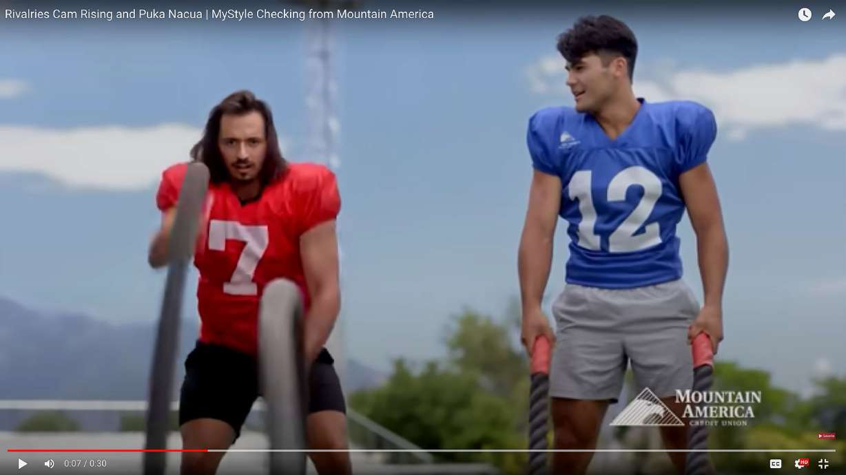 University of Utah quarterback Cam Rising, left, and Brigham Young University receiver Puka Nacua, right, appear in a new Mountain American Credit Union television commercial posted on YouTube Aug. 10.