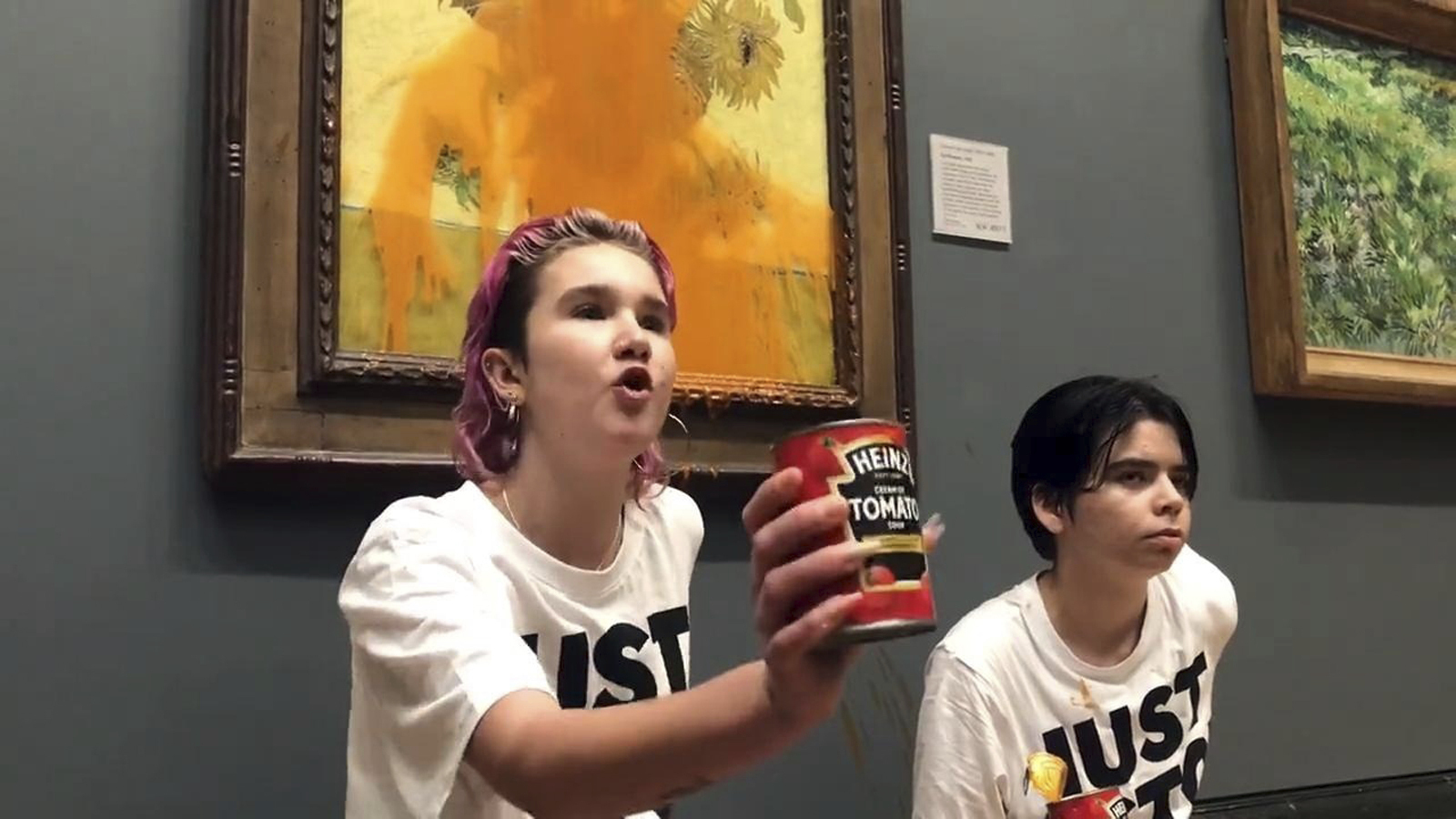 Two protesters threw canned soup at Vincent Van Gogh's famous 1888 work Sunflowers at the National Gallery in London, Friday. 