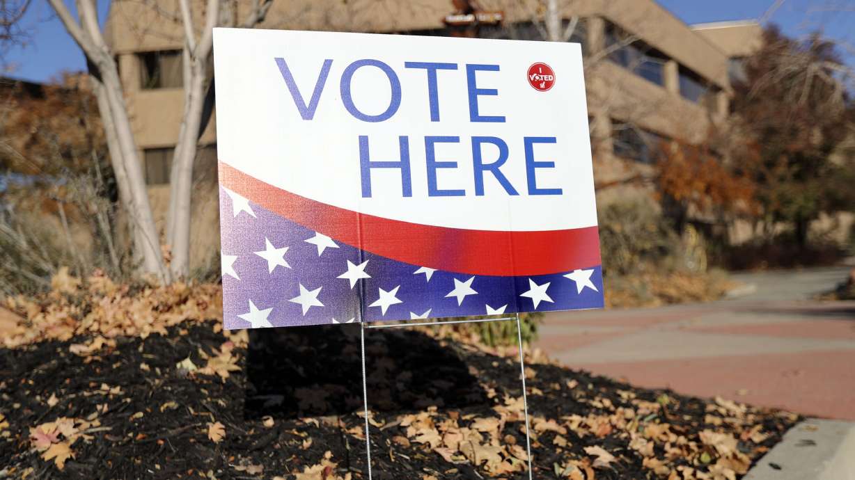 A “Vote Here” sign is pictured on Election Day at the Salt Lake County Government Center in Salt Lake City on Nov. 5, 2019. The Dignity Index released their latest scores for the 4th Congressional District debate between Darlene McDonald, January Walker and Rep. Burgess Owens, who did not attend.