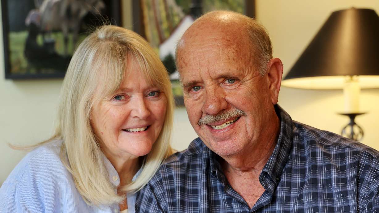 Ron and Sy Snarr, of Salt Lake City, pose for a photo on Aug. 19, after describing their relationship today with Jorge Benvenuto, who murdered their son, Zachary Snarr, in August 1996.