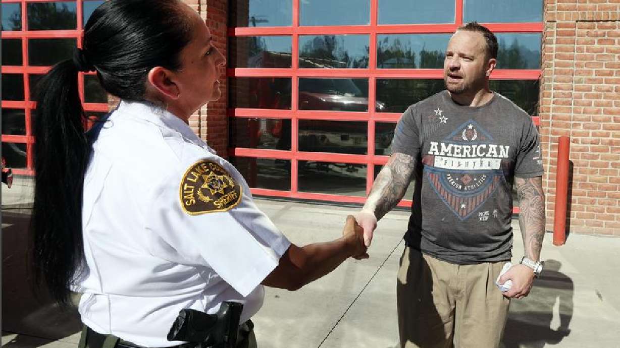 Salt Lake County Sheriff Rosie Rivera thanks Chris Lovell, a recovering drug addict, for warning the public about the dangers of fentanyl-laced drugs on Friday. The sheriff's office is concerned about "rainbow fentanyl" being marketed by drug dealers toward young people.