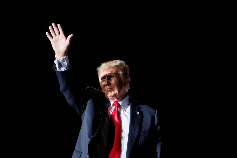 Former U.S. President Donald Trump waves after his speech during a rally at the Iowa States Fairgrounds in Des Moines, Iowa, October 9, 2021.