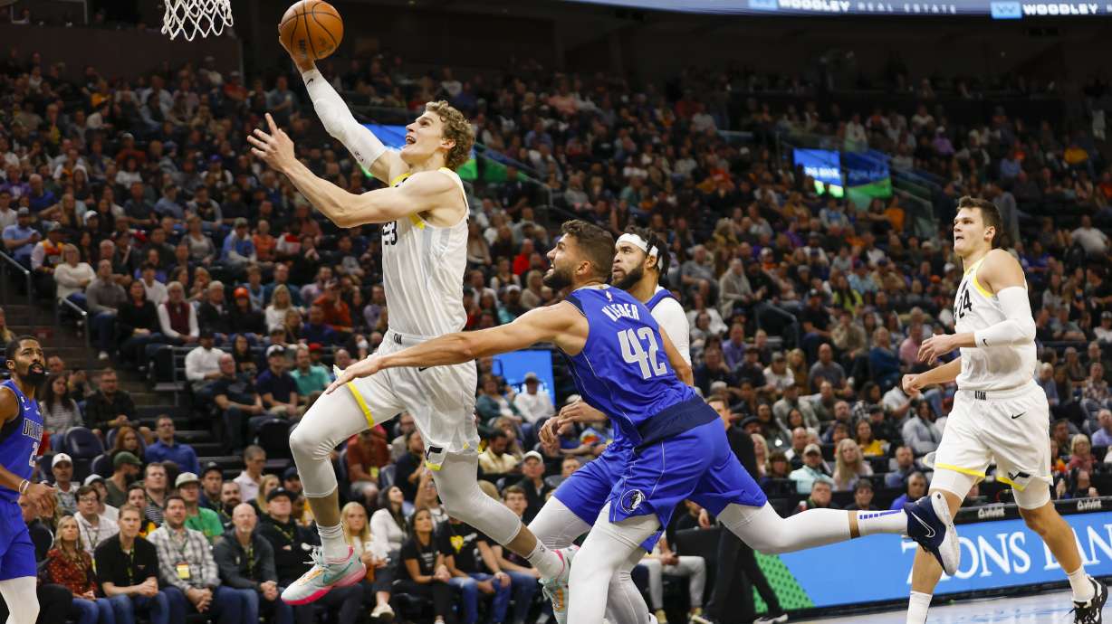 Lauri Markkanen (23) of the Jazz drives to the net while playing the Mavericks in Salt Lake City on Friday, Oct. 14, 2022. The Mavericks won 115-101.