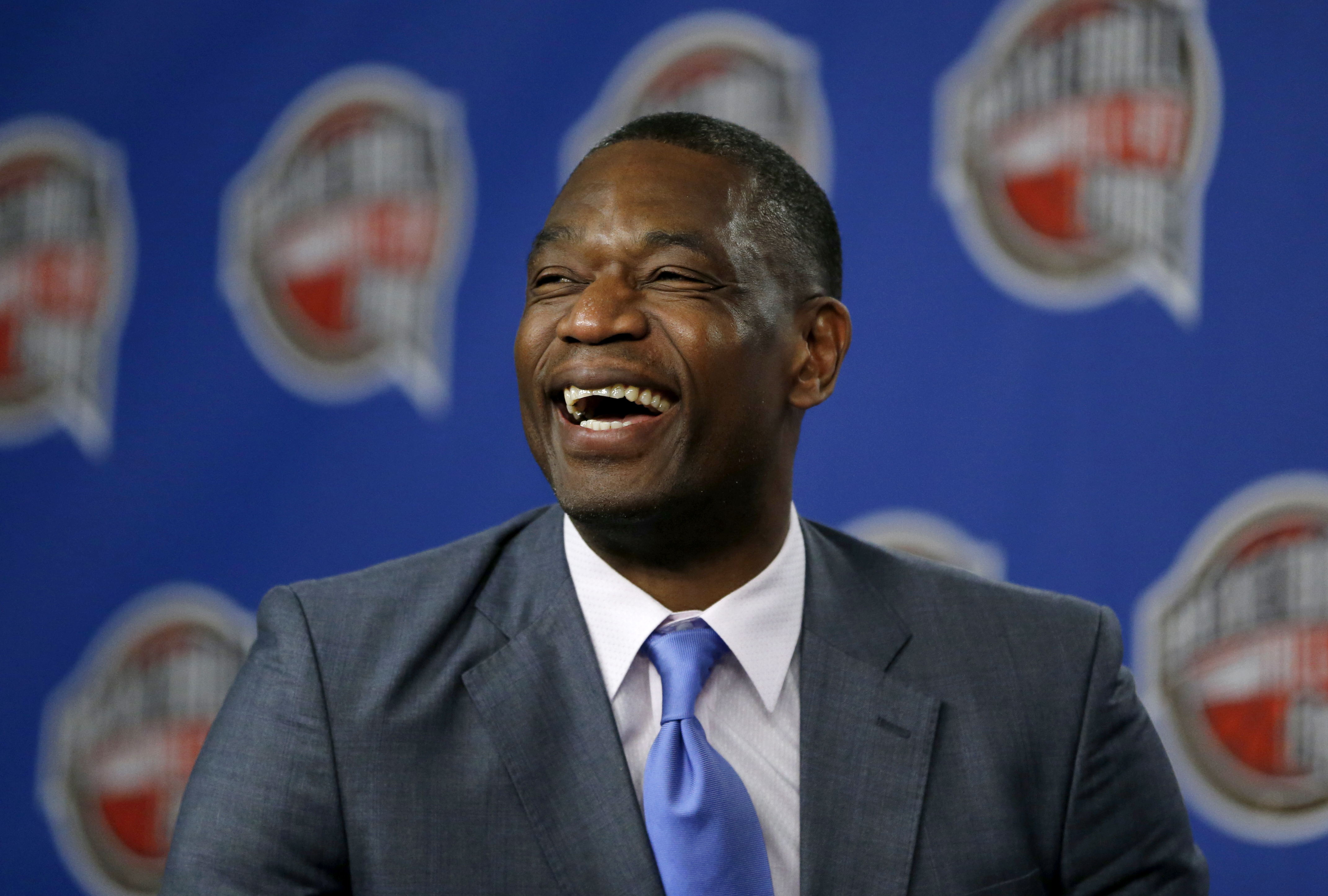 FILE - Former NBA basketball player Dikembe Mutombo laughs during a news conference announcing him as one of the 12 finalists of this year's hall of fame class during an event ahead of the NBA All Star basketball game, on Feb. 14, 2015, in New York. Mutombo is undergoing treatment in Atlanta for a brain tumor, the NBA announced Saturday, OCt. 15, 2022,