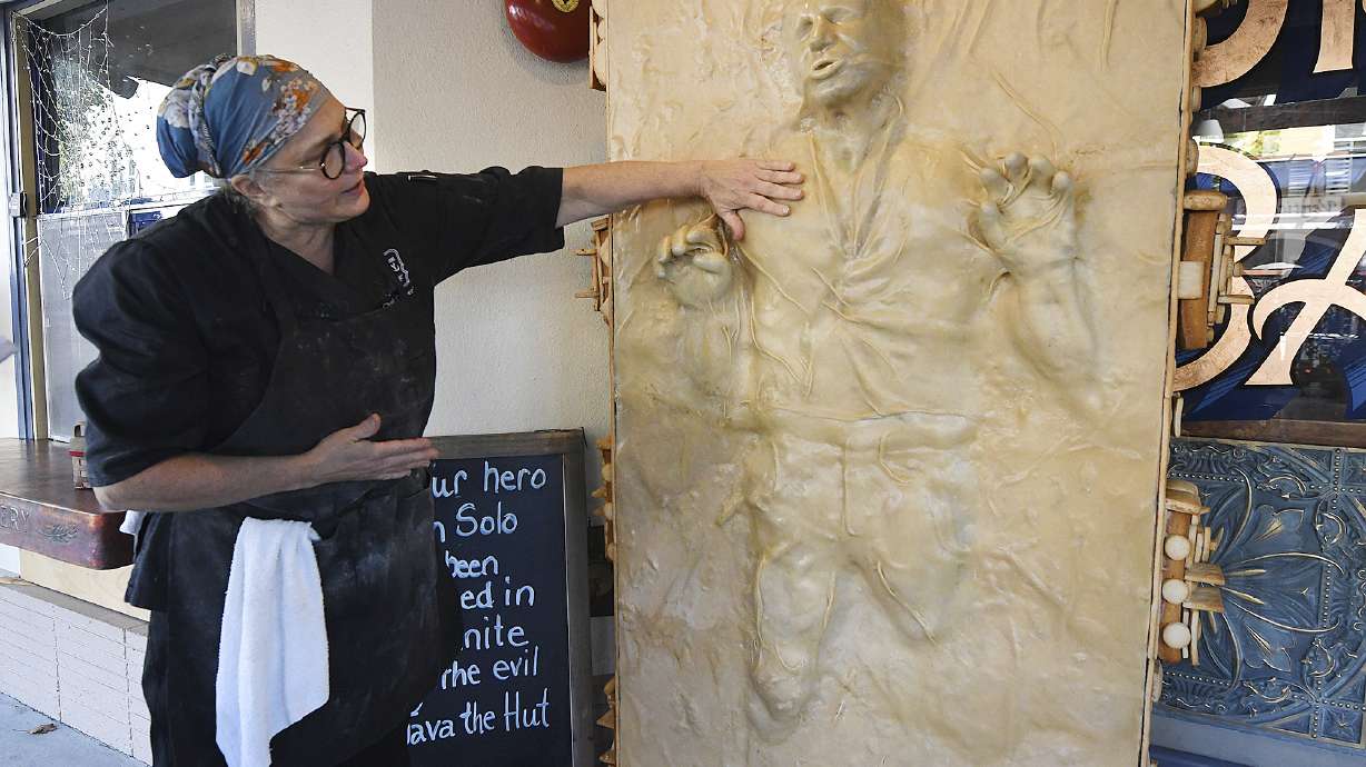 Catherine Pervan, with Our House Bakery in Benicia, Calif., talks about creating the life-sized Han Solo on Saturday. The piece is the bakery's entry in the downtown Benicia scarecrow contest.