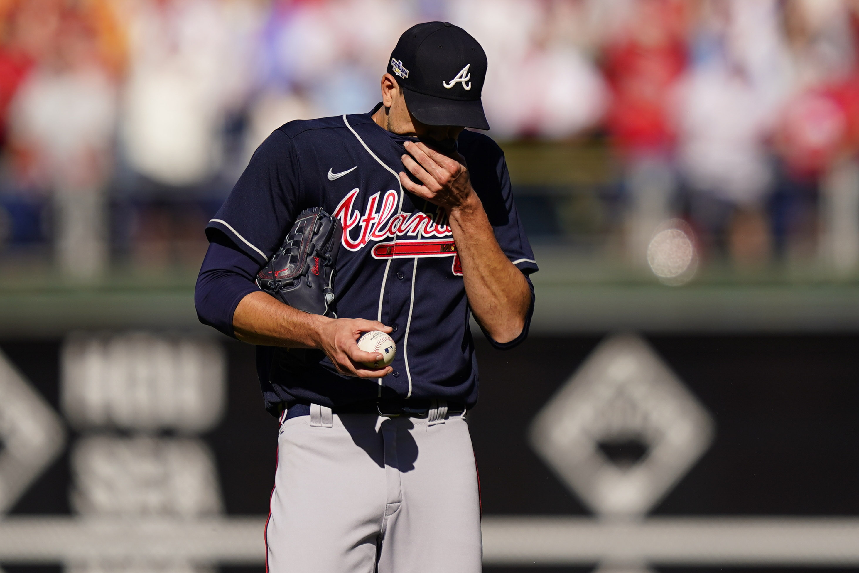Atlanta Braves starting pitcher Charlie Morton (50) wipes his face during the second inning in Game 4 of baseball's National League Division Series between the Philadelphia Phillies and the Atlanta Braves, Saturday, Oct. 15, 2022, in Philadelphia.
