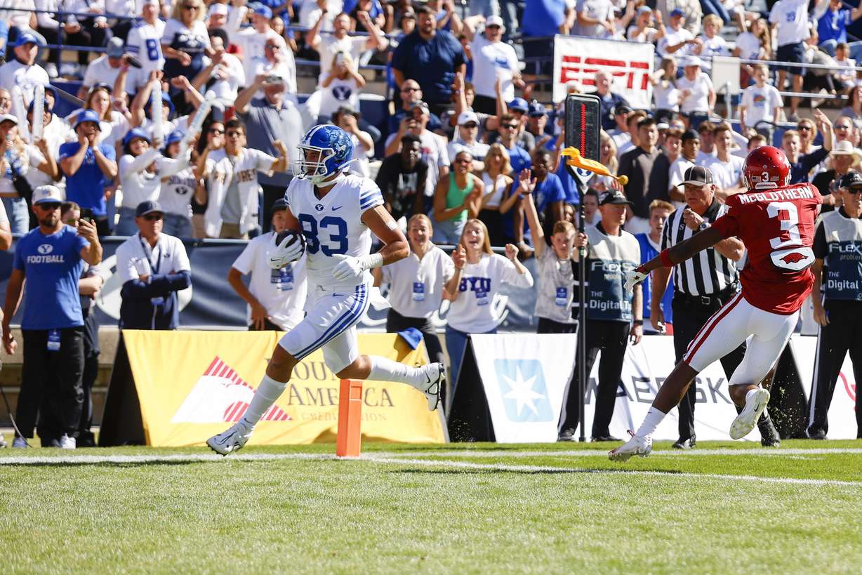 BYU tight end Isaac Rex (83) runs into the end zone for a touchdown against the Arkansas Razorbacks in Provo on Saturday, Oct. 15, 2022.
